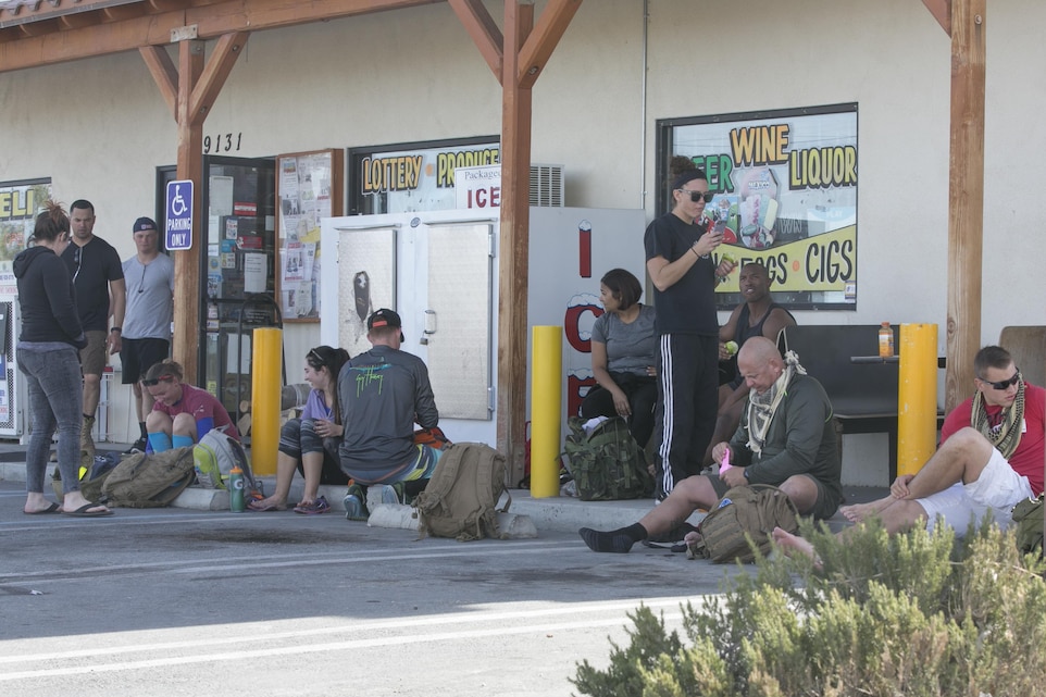 Participants of the second annual Road March for St. Jude Children’s Research Hospital rest at the halfway point in Twentynine Palms, Calif., Dec. 10, 2016. Mark Gelekto, tactical training support, 7th Marine Regiment, organized the event to raise money to donate to children in need. (Official Marine Corps photo by Cpl. Thomas Mudd/Released)