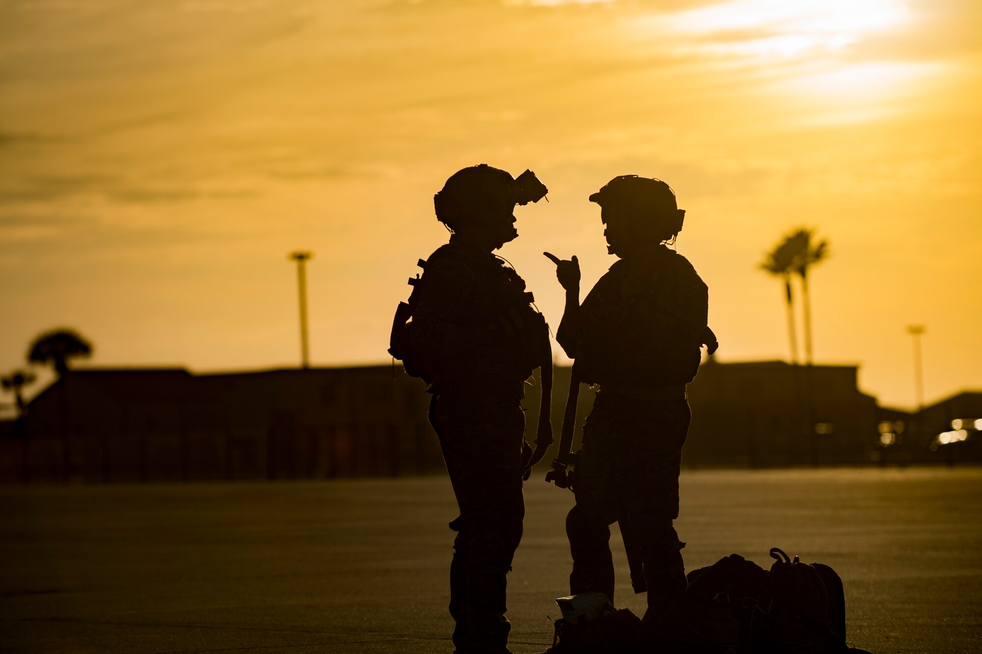 Aircrew members from the 41st Rescue Squadron hold a discussion after landing, Dec. 12, 2016, at Patrick Air Force Base, Fla. The conversation took place during spin-up training conducted to prepare Airmen for upcoming deployments. (U.S. Air Force photo by Airman 1st Class Daniel Snider)