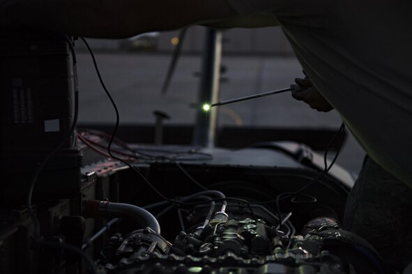 Senior Airman Matthew Steward, left, 41st Helicopter Maintenance Unit crew chief, holds a camera used to inspect the inside of an HH-60G Pave Hawk’s engine, Dec. 12, 2016, at Patrick Air Force Base, Fla. The snakelike camera was fished through the engine checking for any internal damage after striking a bird while in flight. (U.S. Air Force photo by Airman 1st Class Daniel Snider)