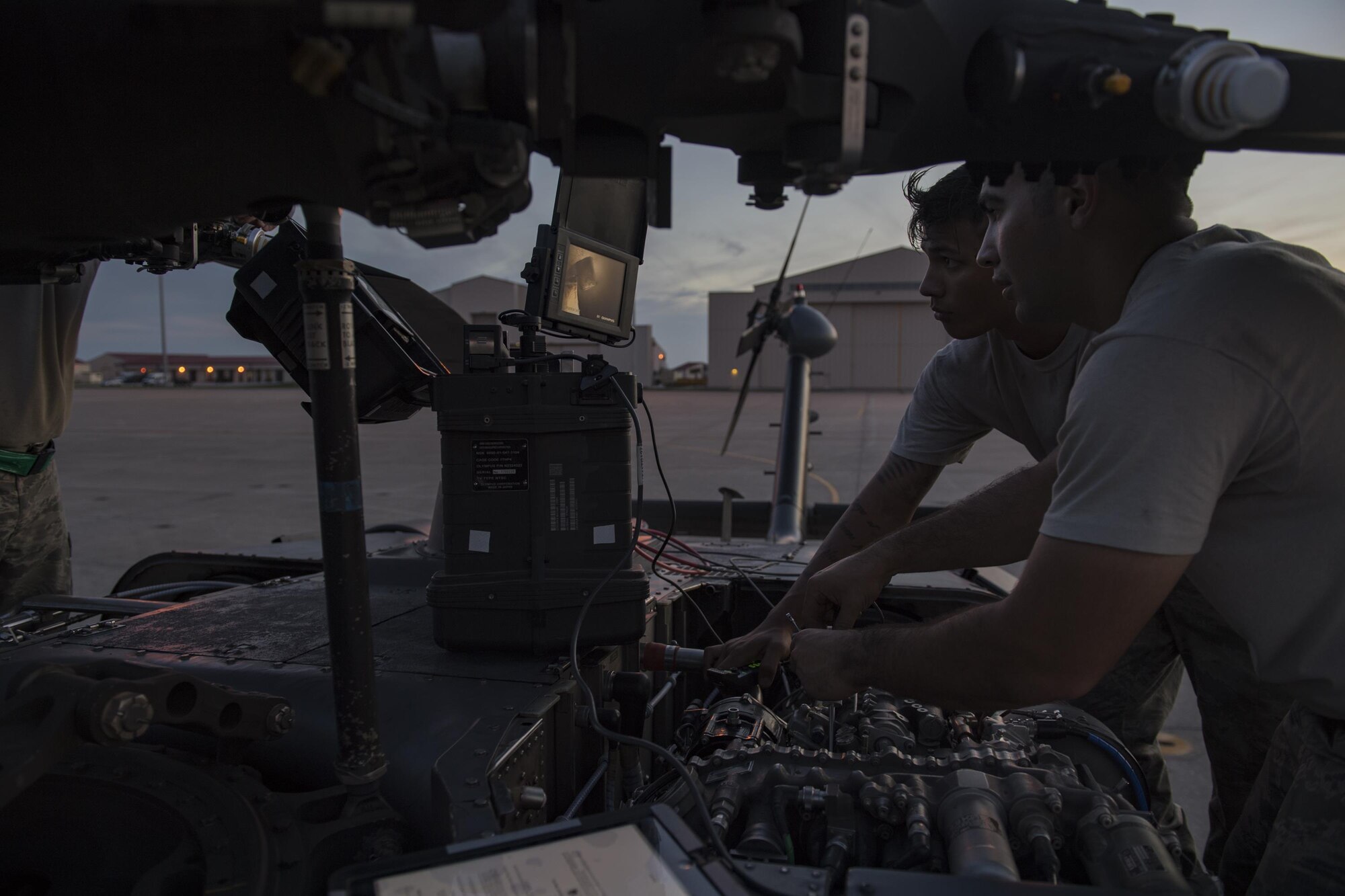 Senior Airmen Matthew Steward, left, 41st Helicopter Maintenance Unit crew chief, and Vivek Lebouef, 41st HMU aerospace propulsion technician, guide a small camera through the intake of an HH-60G Pave Hawk engine, Dec. 12, 2016, at Patrick Air Force Base, Fla. After the helicopter struck a bird, Airmen conducted detailed inspections before flying again. (U.S. Air Force photo by Airman 1st Class Daniel Snider)