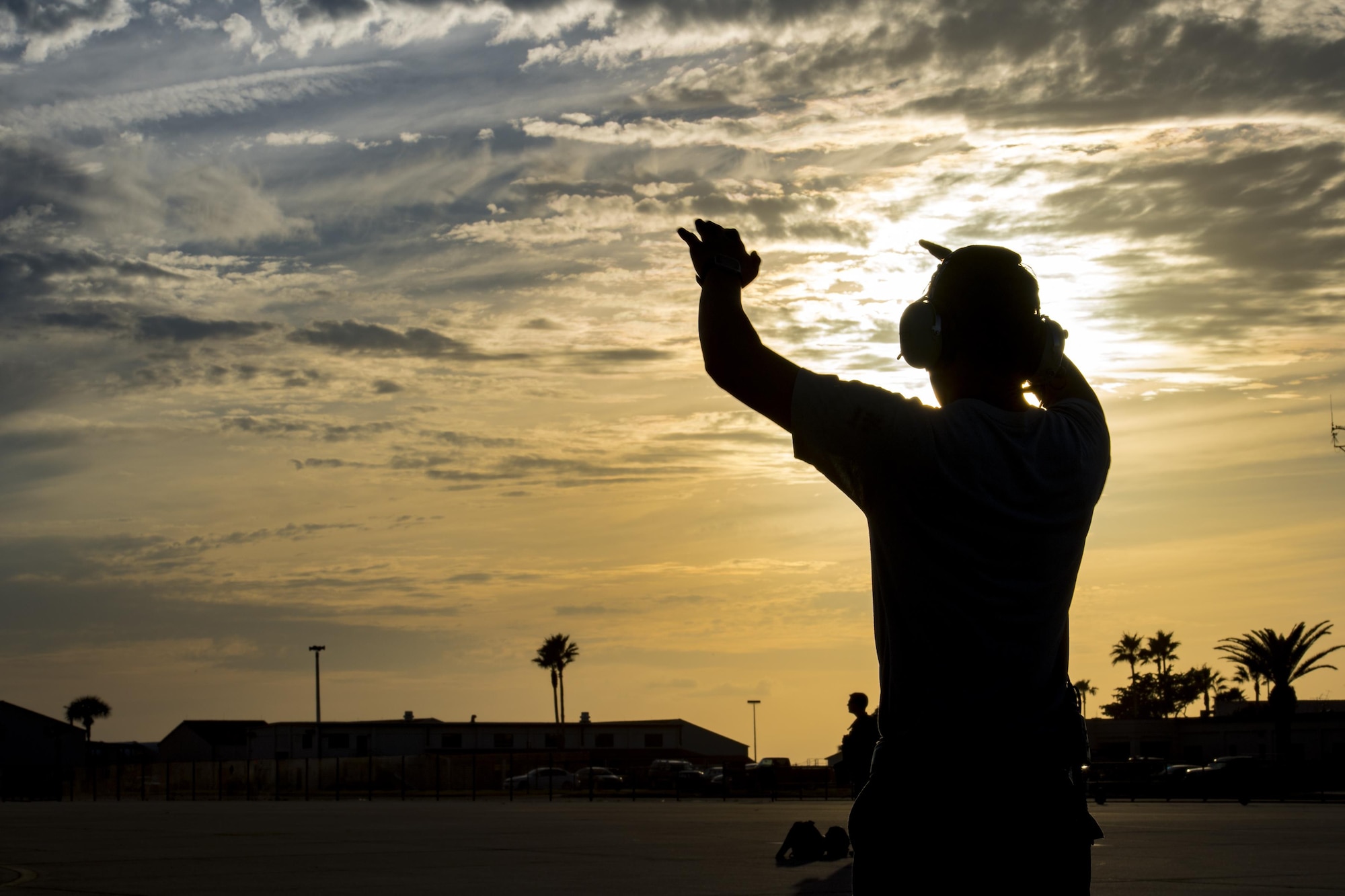 Senior Airman Dylan Shephard, 41st Helicopter Maintenance Unit crew chief, marshals an HH-60G Pave Hawk after a mission, Dec. 12, 2016, at Patrick Air Force Base, Fla. The 41st HMU worked alongside the 41st Rescue Squadron for ten days as they conducted pre-deployment “spin-up” training. The maintainers were responsible for ensuring three aircraft were combat-ready at a moment’s notice and worked around the clock to meet this requirement for both day and night missions. (U.S. Air Force photo by Staff Sgt. Ryan Callaghan)