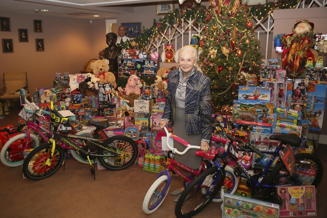 Phyllis M. Taylor, Taylor Energy Company’s chief executive officer, proudly displays the toys collected and donated by Patrick F. Taylor Foundation’s employees at the Patrick F. Taylor Foundation building in New Orleans, Dec. 14, 2016. Every year the Patrick F. Taylor Foundation receives individual donations from its employees in order to support the Toys For Tots annual toy drive. The program collects new, unwrapped toys during the holiday season so that less fortunate children may have a new toy to open during the holidays. (U.S. Marine Corps photo by Sgt. Ian Ferro)