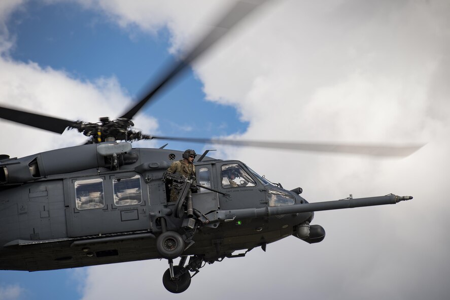 A special missions aviator from the 41st Rescue Squadron scans for threats as part of a training mission during a ‘spin-up’ exercise, Dec. 13, 2016, at Avon Park Air Force Range, Fla. During the spin-up, the 41st RQS, alongside mission partners from the 38th and 71st Rescue Squadrons, conducted high-tempo rescue operations designed to mimic the missions they will fly downrange. They based their operations out of Patrick AFB and flew missions to Avon Park Air Force Range, Fla.(U.S. Air Force photo by Staff Sgt. Ryan Callaghan)
