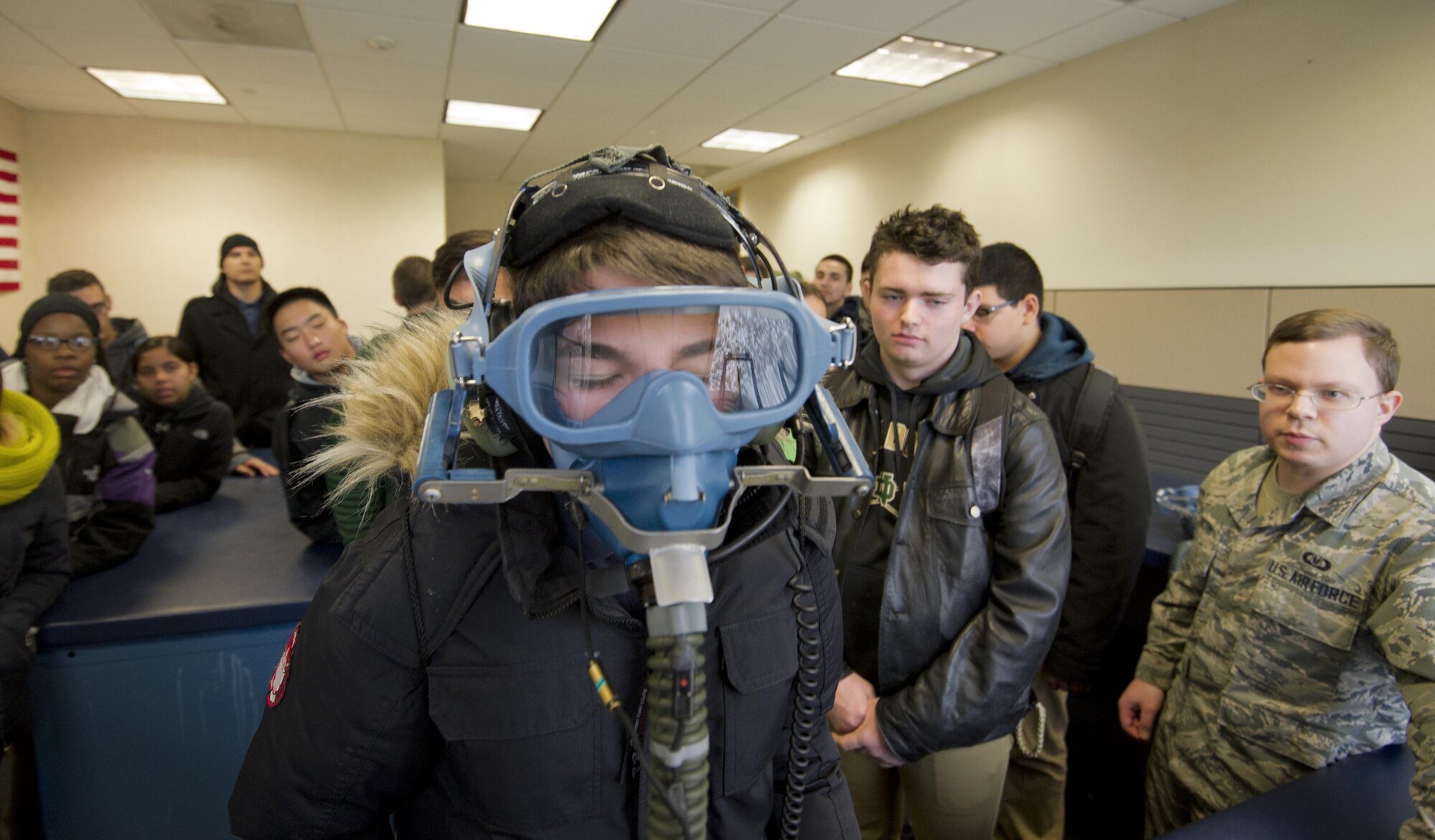 Members of the New Dorp High School Air Force JROTC take turns using an oxygen mask during a recent tour of the 514th Air Mobility Wing here Dec. 15. 