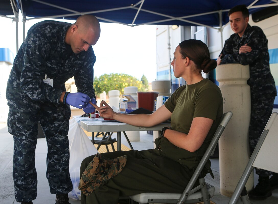 A Marine gets her blood tested for donation aboard Marine Corps Air Station Miramar, Calif., Dec. 14. The Navy Medical Center of San Diego opens opportunities to service members on surrounding military bases in San Diego, to donate blood to the Armed Services Blood Program (ASBP). (U.S. Marine Corps photo by Cpl. Harley Robinson/Released)