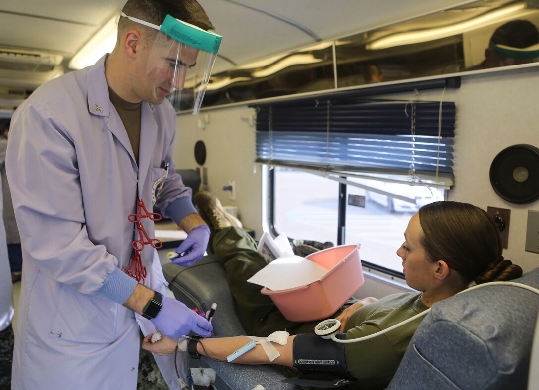 A Marine donates blood to the Armed Services Blood Program aboard Marine Corps Air Station Miramar, Calif., Dec. 14. The Navy Medical Center of San Diego opens opportunities to service members on surrounding military bases in San Diego, to donate blood to the ASBP. (U.S. Marine Corps photo by Cpl. Harley Robinson/Released)
