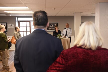 U.S. Air Force Col. Jimmy Canlas, 437th Airlift Wing commander and Federal Executive Association (FEA) military co-chair, middle, welcomes attendees to the Federal Executive Association of the Greater Charleston Area Holiday Coffee Drop-in at Coast Guard Sector Charleston’s Brass Buckle conference room Dec. 16, 2016. More than 90 representatives from federal agencies in the Charleston area attended the Holiday Coffee Drop-in. The Federal Executive Association promotes coordination of federal agency programs for maximum public benefit and to foster stronger relationships between the agencies’ management officials. Canlas is the military co-chair of the FEA in addition to his role as wing commander.