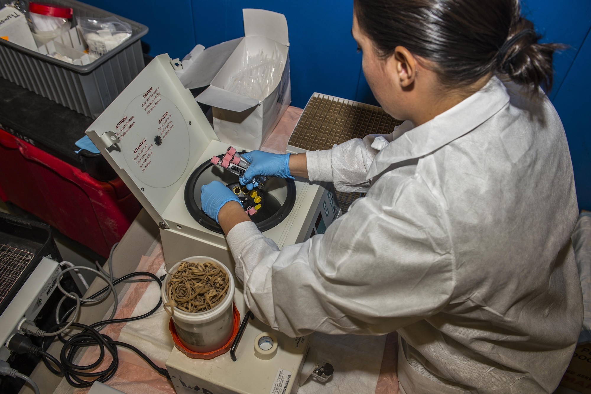 A laboratory technician organizes vials of blood in a centrifuge during an Armed Forces Blood Program blood drive in bldg. 54’s gym on Nov. 16, 2016, Cannon AFB, N.M. The donated blood is sent to forward operating bases and military medical agencies around the world to continually support military blood transfusions. (U.S. Air Force photo by Senior Airman Luke Kitterman/Released)