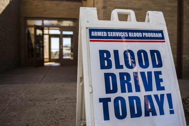A sign promoting an Armed Services Blood Program blood drive sits outside of bldg. 54 on Nov. 16, 2016, Cannon AFB, N.M. The ASBP hosts a blood drive at Cannon approximately once every two months and facilitates more than 50 donors each visit. (U.S. Air Force photo by Senior Airman Luke Kitterman/Released)