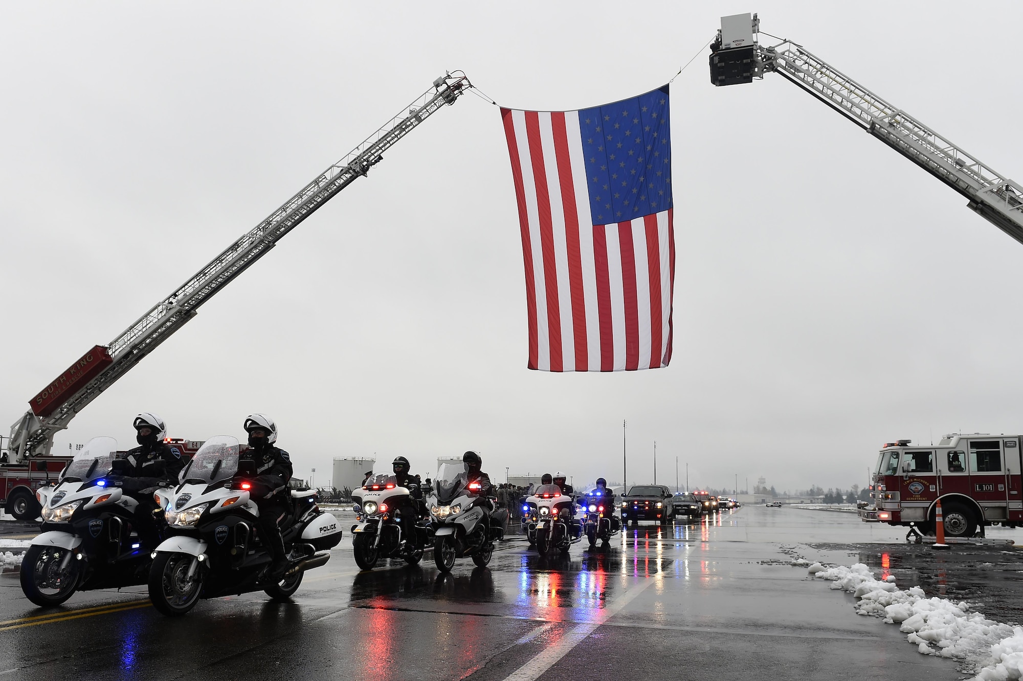 The funeral procession for Tacoma Police Officer Reginald “Jake” Gutierrez leaves Joint Base Lewis-McChord, Wash., Dec. 9, 2016, on their way to the funeral location at the Tacoma Dome in Tacoma, Wash. JBLM was chosen as the staging area because of its ability to accommodate the more than 450 vehicles and its proximity to the funeral location created the least amount of impact to the surrounding traffic patterns. (U.S. Air Force photo/Tech. Sgt. Tim Chacon)