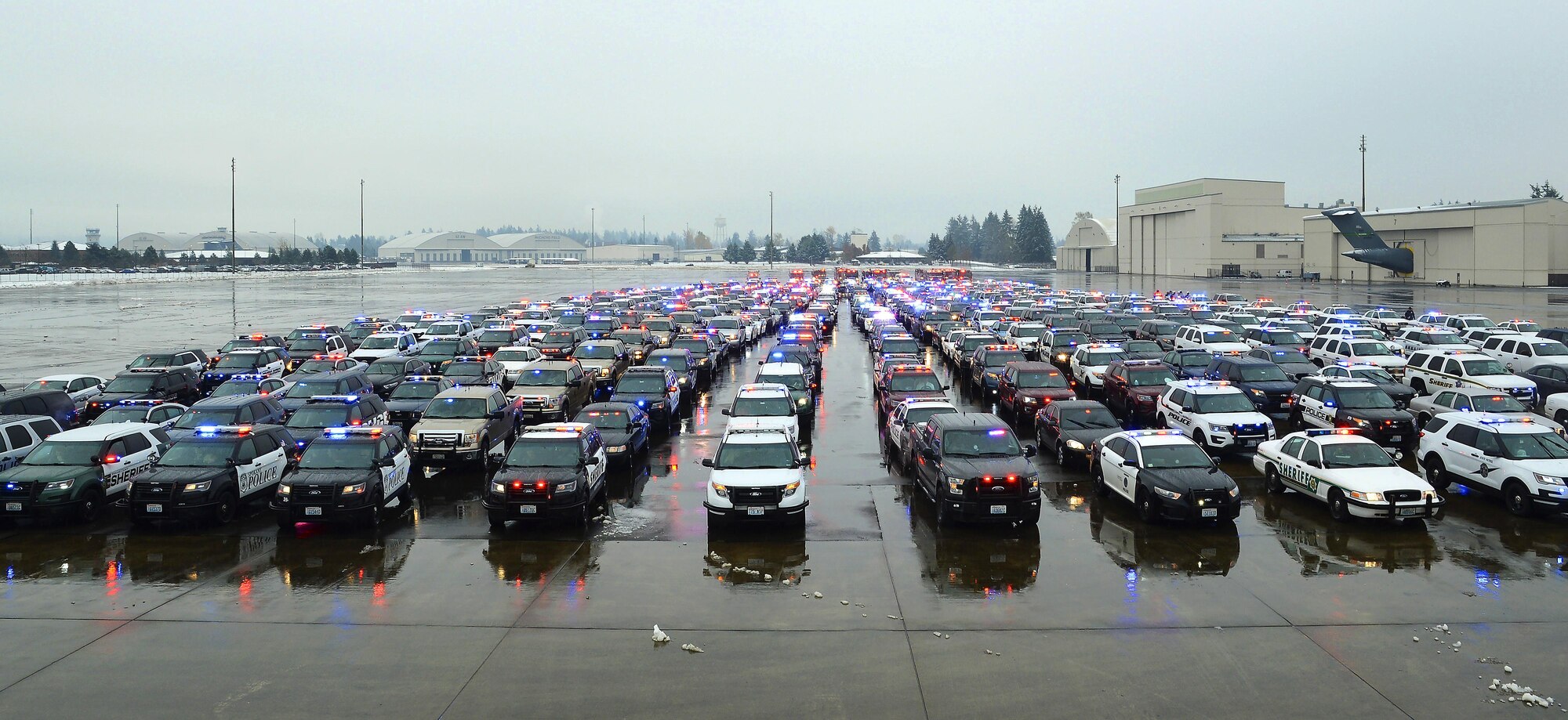 More than 450 emergency response vehicles prepare to leave the McChord Filed flightline on Joint Base Lewis-McChord, Wash., Dec. 9, 2016. The vehicles staged at JBLM for the funeral procession of Tacoma Police Officer Reginald “Jake” Gutierrez. Officer Gutierrez was killed in the line of duty Nov. 30, 2016. (U.S. Air Force photo/Tech. Sgt. Sean Tobin)