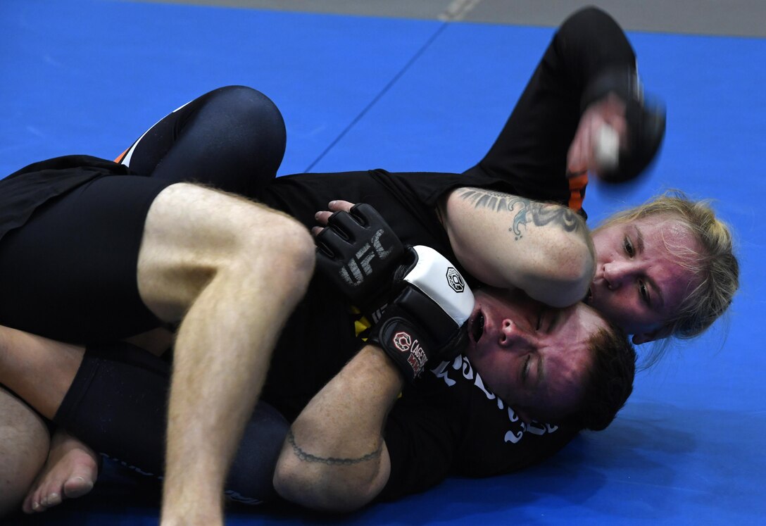 Valentina Shevchenko, Ultimate Fighting Championship mixed martial artist, spars with U.S. Army Sgt. Dale Addy, 128th Aviation Brigade, at Joint Base Langley-Eustis, Va., Dec. 9, 2016. Shevchenko not only trained with service members, but also visited U.S. Army and U.S. Air Force units throughout the week as part of a military appreciation visit. She is also a professional kickboxer from Kyrgyzstan, who began her professional career when she was 12 years old, when she knocked out a 22-year-old opponent, earning the nickname “Bullet.” (U.S. Air Force photo by Staff Sgt. Nick Wilson)