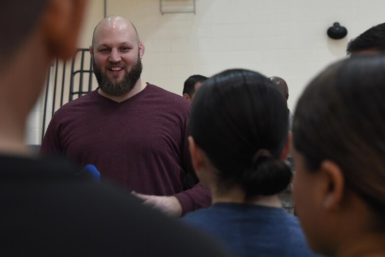 Ben Rothwell, Ultimate Fighting Championship mixed martial artist, speaks to Airmen about mental toughness and how the mental toughness required to be a UFC fighter is similar to the mental toughness required to go to war during a morale visit at Joint Base Langley-Eustis, Va., Dec. 9, 2016. During the base tour, Rothwell told service members about how MMA not only changed his life, but made him become more resilient as he trained adult and adolescent students in his gym. (U.S. Air Force photo by Staff Sgt. Nick Wilson)
