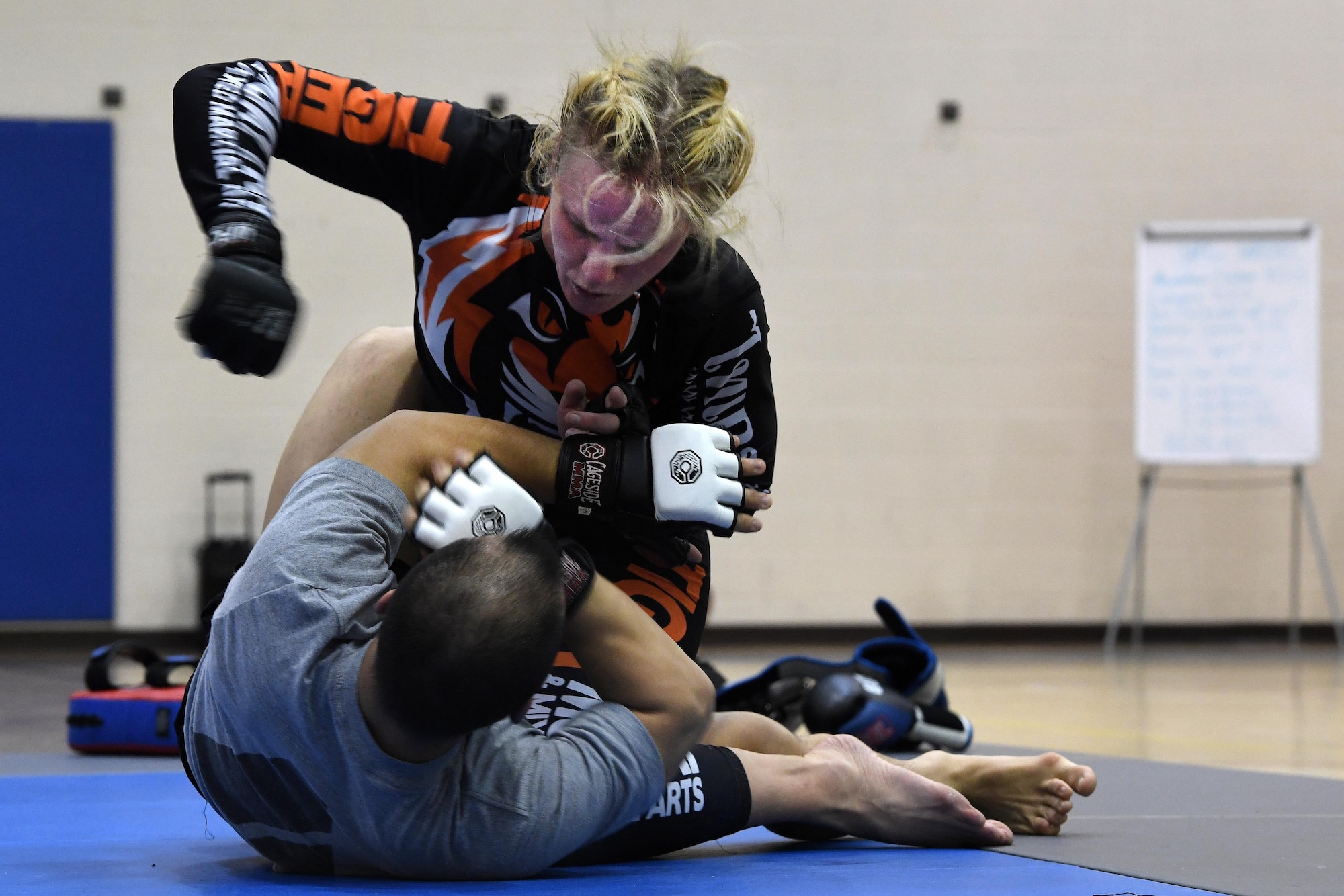 Valentina Shevchenko, Ultimate Fighting Championship mixed martial artist, spars with U.S. Army Sgt. Dale Addy, 128th Aviation Brigade at Joint Base Langley-Eustis, Va., Dec. 9, 2016. Shevchenko not only trained with service members, but also visited U.S. Army and U.S. Air Force units throughout the week as part of a military appreciation visit. She is also a professional kickboxer from Kyrgyzstan, who began her professional career when she was 12 years old, when she knocked out a 22-year-old opponent, earning the nickname “Bullet.” (U.S. Air Force photo by Staff Sgt. Nick Wilson)