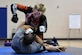 Valentina Shevchenko, Ultimate Fighting Championship mixed martial artist, spars with U.S. Army Sgt. Dale Addy, 128th Aviation Brigade at Joint Base Langley-Eustis, Va., Dec. 9, 2016. Shevchenko not only trained with service members, but also visited U.S. Army and U.S. Air Force units throughout the week as part of a military appreciation visit. She is also a professional kickboxer from Kyrgyzstan, who began her professional career when she was 12 years old, when she knocked out a 22-year-old opponent, earning the nickname “Bullet.” (U.S. Air Force photo by Staff Sgt. Nick Wilson)