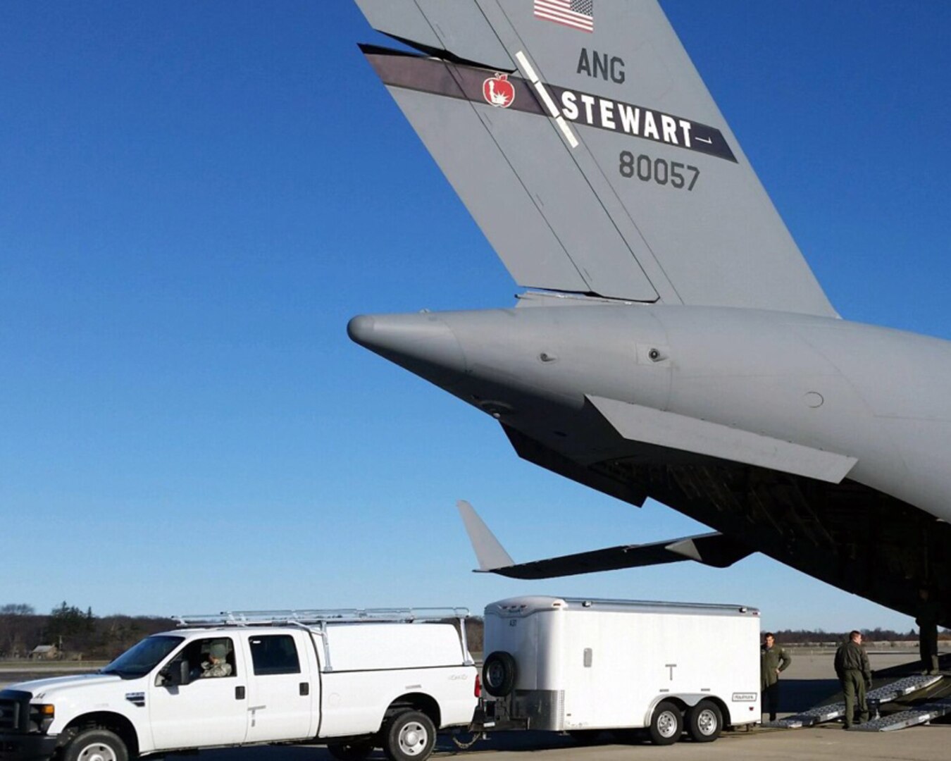 Civilian-type vehicles assigned to the New York National Guard's Homeland Response Force and operated by the 206th Military Police Company of the New York Army National Guard, are guided onto a C-17 Globemaster III, operated by the New York Air National Guard's 105th Airlift Wing, during joint air load training conducted at Stewart Air National Guard Base on Dec. 3, 2016. 