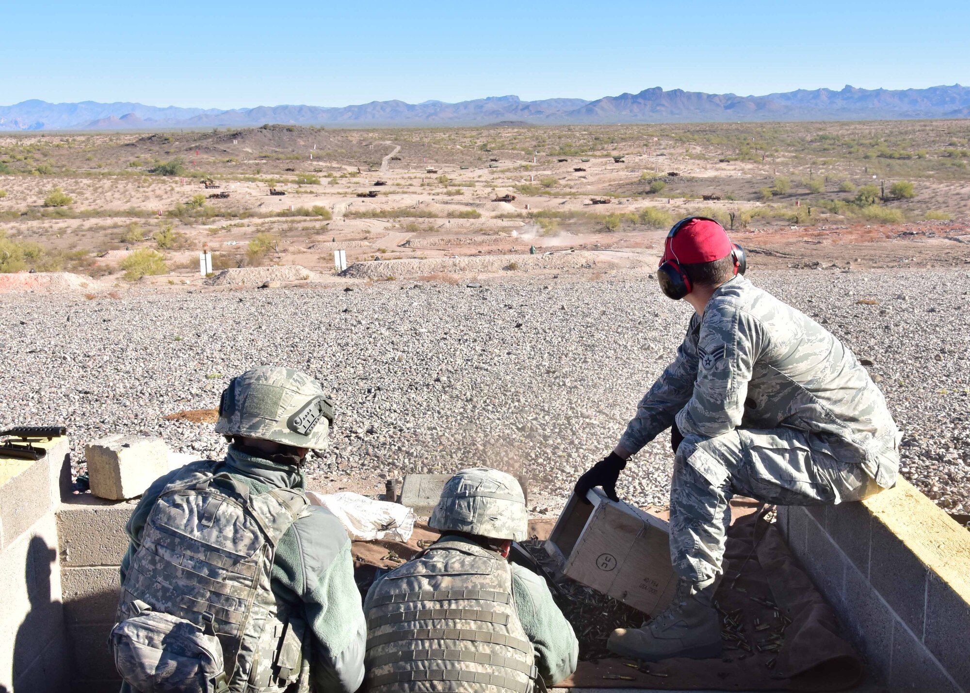 Airmen from the 944th Security Forces Squadron conduct their annual heavy weapons qualification training Dec. 3 at the Army National Guard range in Florence, Ariz. The fire team member’s qualified on the M240B, M249, and M203 grenade launcher. (U.S. Air Force photo taken by Tech. Sgt. Louis Vega Jr.)
