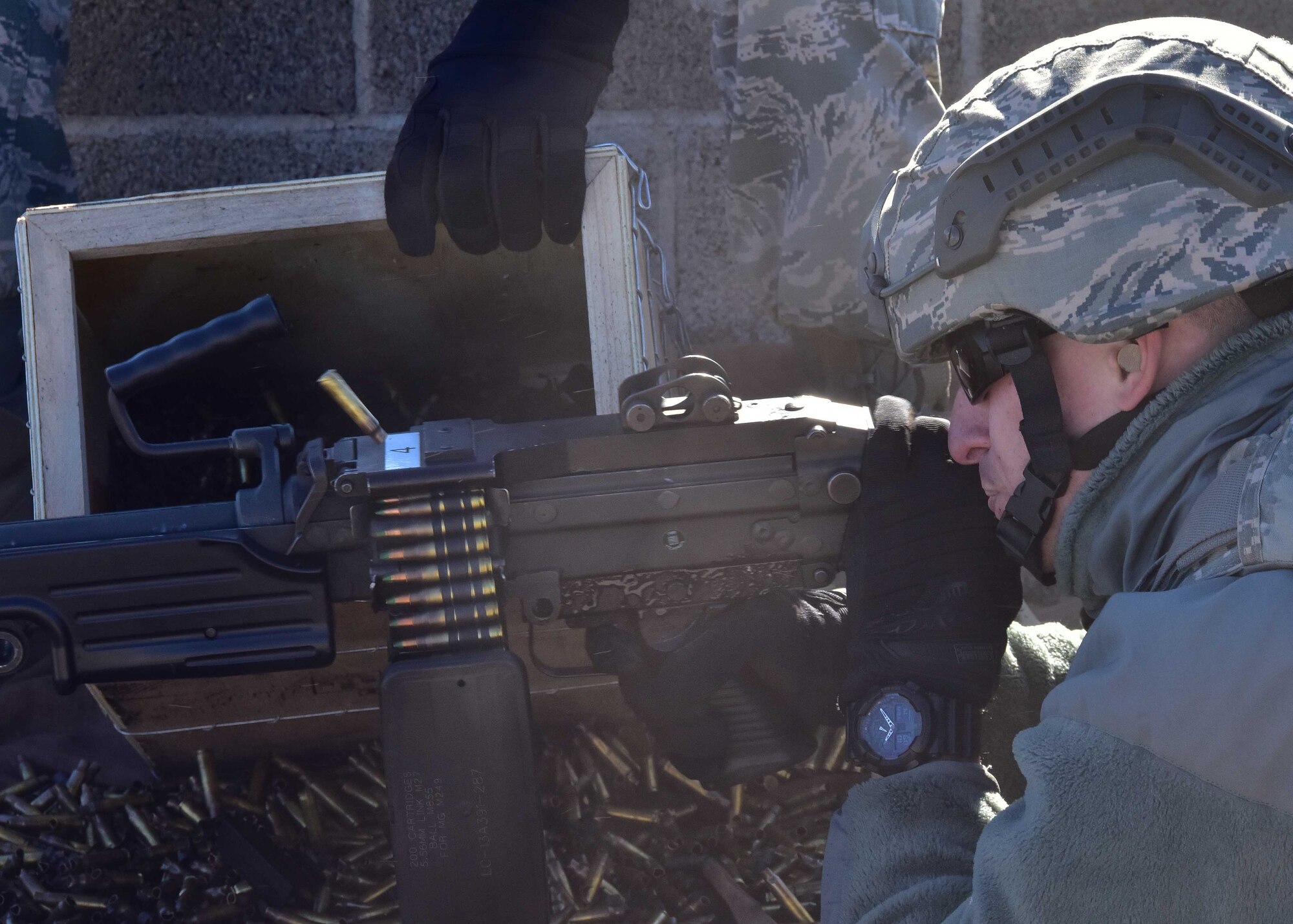 A 944th Security Forces fire team Airman, fires the M249 Dec. 3 during his annual heavy weapons qualification training at the Army National Guard range in Florence, Ariz. (U.S. Air Force photo taken by Tech. Sgt. Louis Vega Jr.)