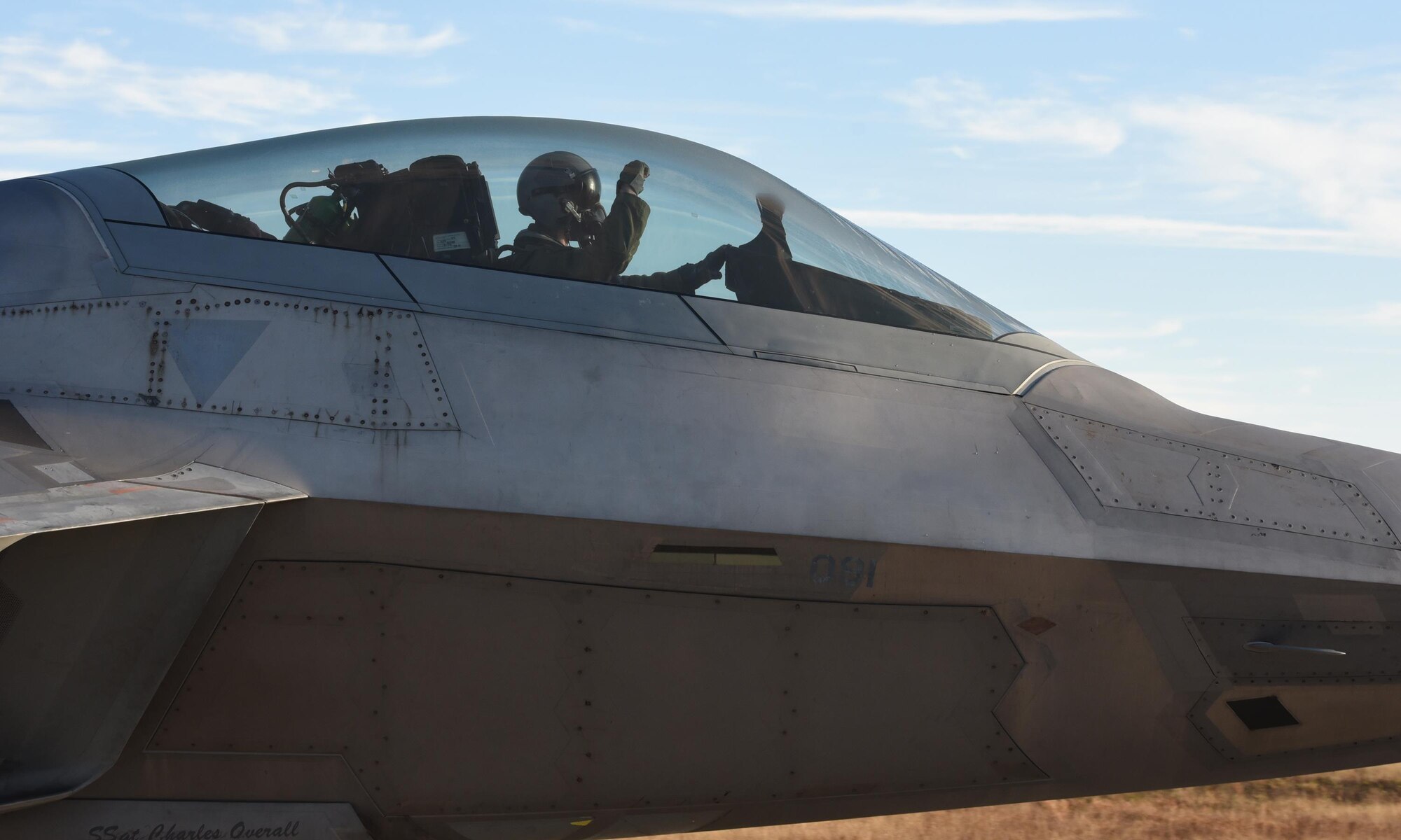 A U.S. Air Force F-22 Raptor pilot from Tyndall Air Force Base, Fla., taxis down the Tyndall flightline during Checkered Flag 17-1, Dec. 8, 2016. During the exercise, pilots and Airmen from Tyndall work with members from Shaw AFB, S.C.; Mountain Home AFB, Idaho; Moody AFB, Ga.; Eglin AFB, Fla.; and Tinker AFB, Okla., as well as the Florida and Louisiana Air National Guard. (U.S. Air Force photo by Staff Sgt. Alex Fox Echols III/Released)