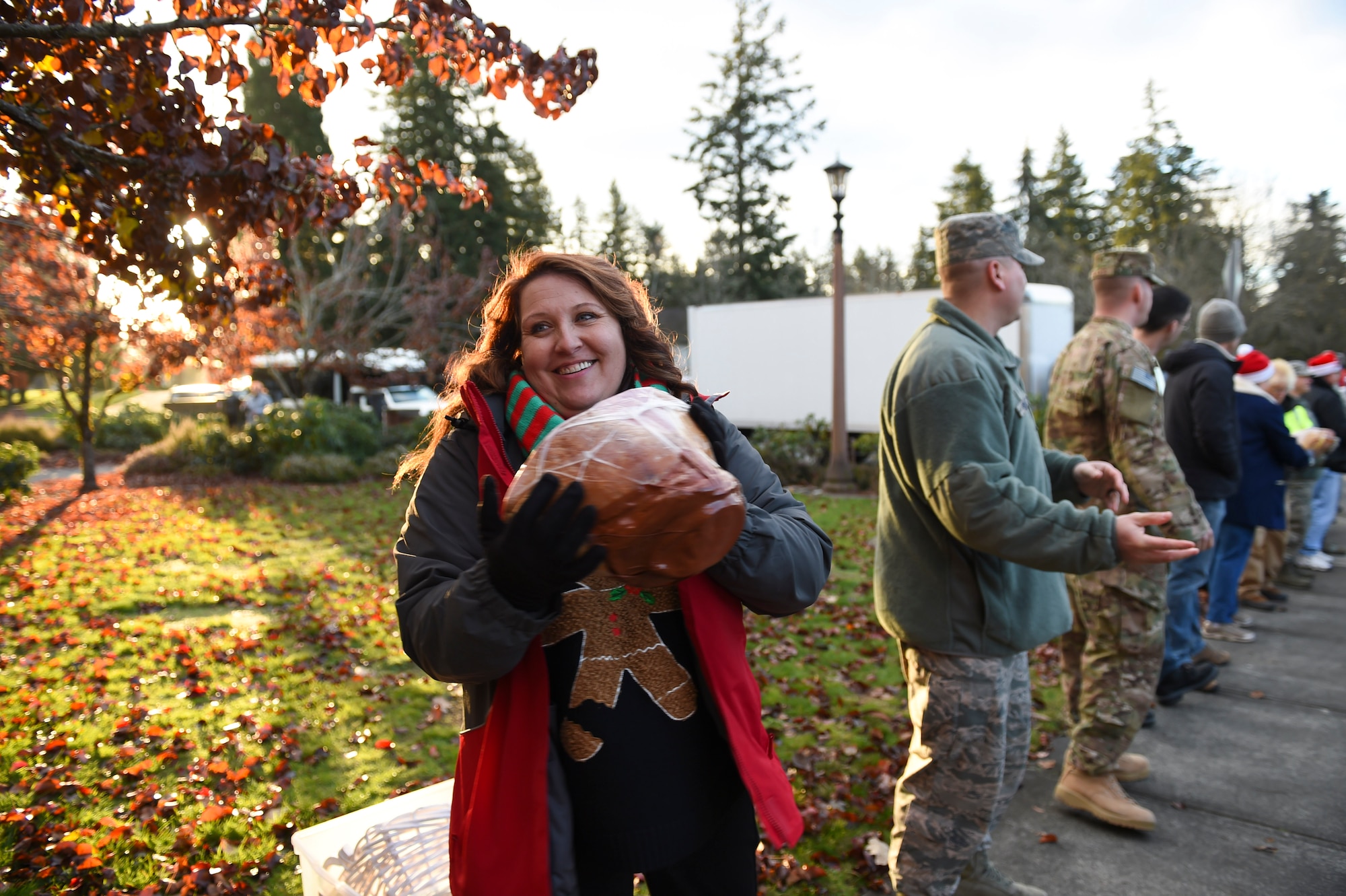 Local community leaders and 62nd Airlift Wing members participate in Operation Ham Grenade on Joint Base Lewis-McChord, Wash. Dec. 16, 2016. More than two hundred hams were delivered to the 62nd AW, to be distributed out to Airmen for the December holidays. (U.S. Air Force photo/Staff Sgt. Naomi Shipley)