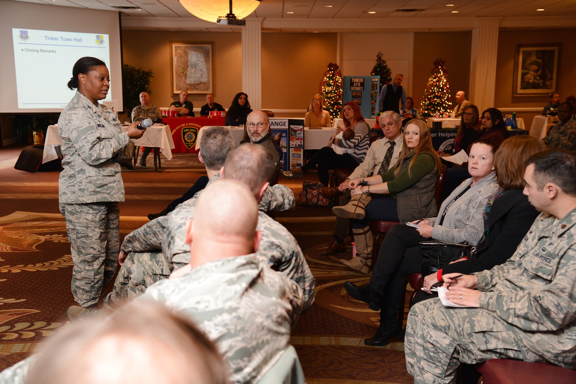 72nd Air Base Wing Commander Col. Stephanie Wilson gives closing remarks and answers questions from audience members during the 72nd Air Base Wing Town Hall Dec. 7. Topics included: Clinic, delivery of care, access, pharmacy, referrals, Real ID Act, weapons registration/transfer, gate traffic, Space-A travel, Tinker road construction plan, Integrated Delivery System (Tinker Helping Agencies) overview, OSI brief on impact of underage relationships, chapel worship schedule, resources and holiday events. The last hour was dedicated to information booths that included Tinker Fire and Emergency Services, privatized housing (CE unaccompanied housing and referral offices), clinic, Family Advocacy, Airman and Family Readiness, Health Promotions, Chapel, Youth/Child Development Centers, Sexual Assault Prevention and Response Office, Oklahoma City Air Logistics Complex Community Outreach program for regional high schools and technology centers and the Exchange. (Air Force photo by Kelly White)