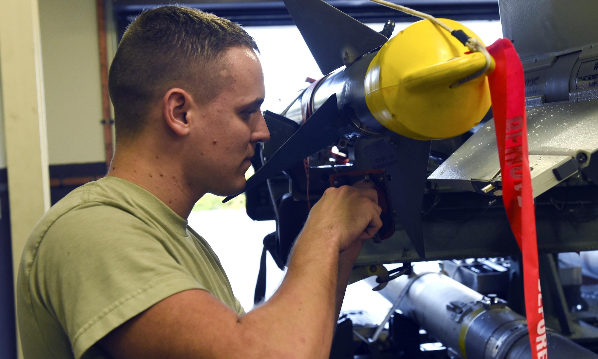 U.S. Air Force Senior Airman Bradly Grigg, 325th Maintenance Squadron munitions systems specialist, performs maintenance on a weapons system in preparation for  use in Checkered Flag 17-1 and Combat Archer 17-3 at Tyndall Air Force Base, Fla., Dec. 14, 2016. Tyndall’s Munitions Flight plays a heavy role in supporting multiple exercises and evaluations that the 325th Fighter Wing takes part in throughout each year. (U.S. Air Force photo by Airman 1st Class Cody R. Miller/Released)