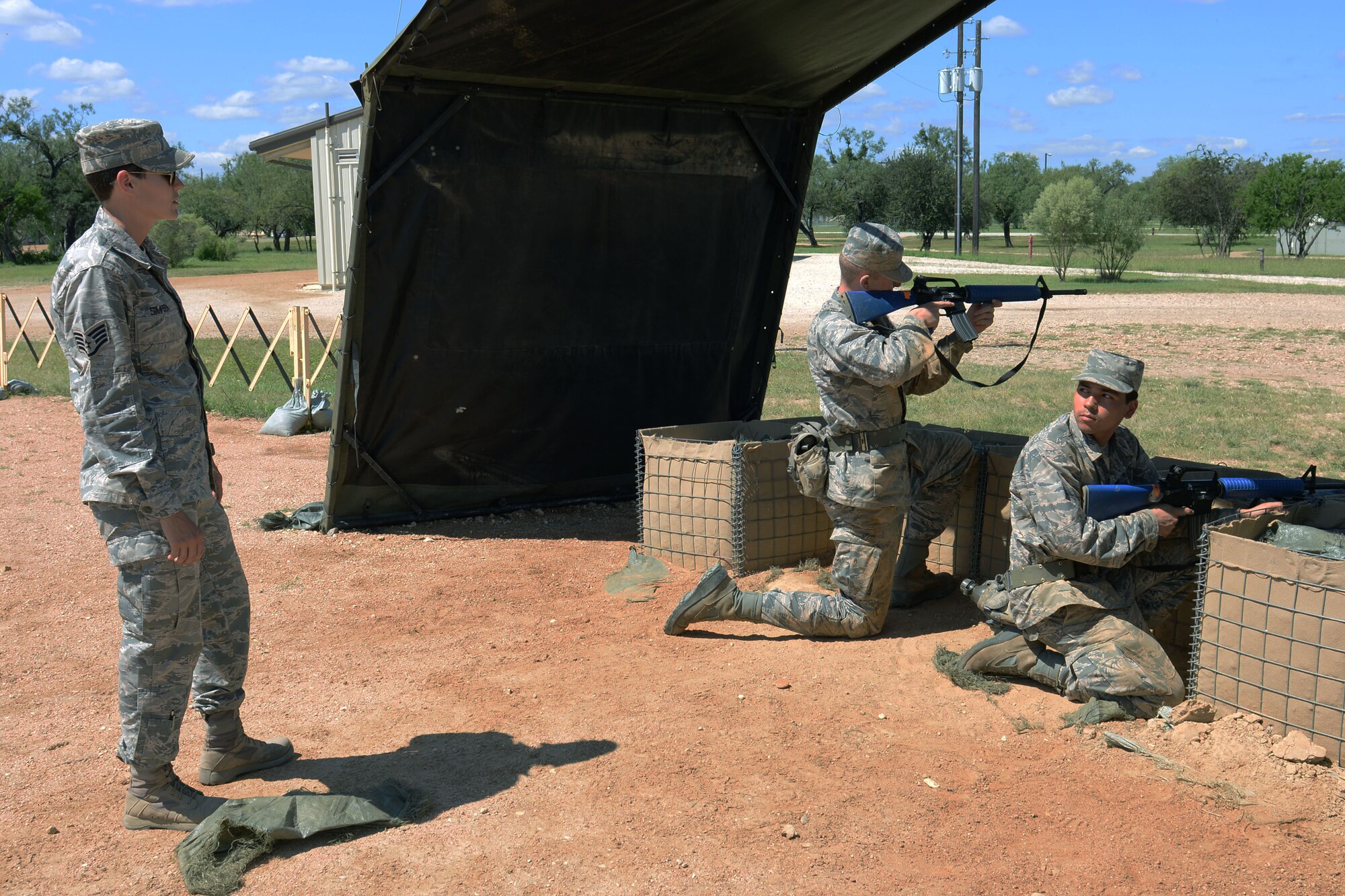 Staff Sgt. Britney Simpson (left), 319th Training Squadron military training instructor, directs trainees on proper escalation of force procedures during a training exercise Sept. 28 at the Joint Base San Antonio-Lackland
Medina Annex. (U.S. Air Force photo by Staff Sgt. Marissa Garner)
