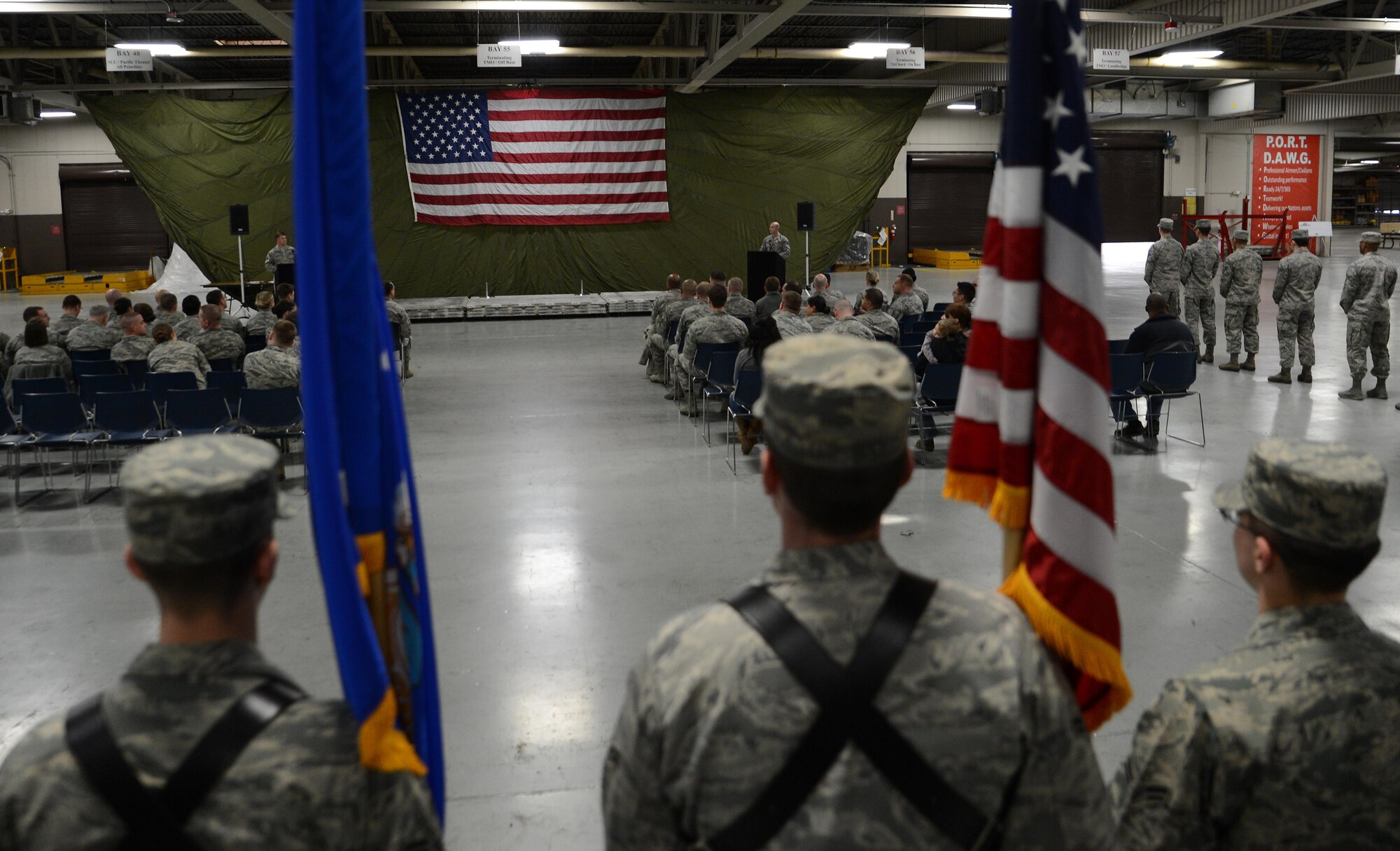 Three Airmen from the McChord Field Honor Guard stand at attention during a change or responsibility ceremony Dec. 13, 2016, at Joint Base Lewis-McChord, Wash. The ceremony was to recognize Airmen who have completed their service in the McChord Field Honor Guard and to initiate their replacements. (U.S. Air Force photo/Senior Airman Jacob Jimenez)     