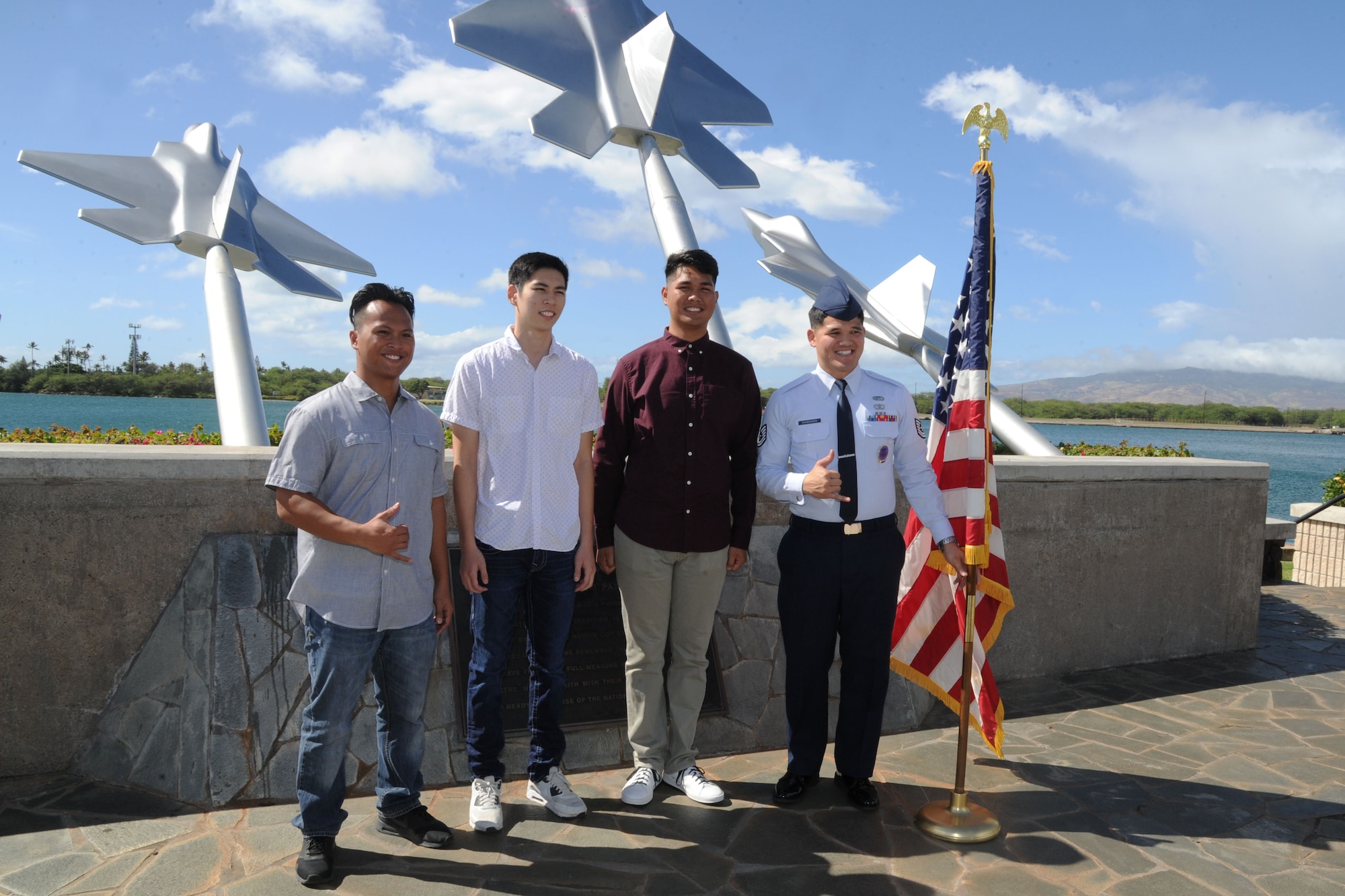 U.S. Air Force Tech. Sgt. Michael Shinohara, right, an Air Force Reserve recruiter based out of Joint Base Pearl Harbor-Hickam, Hawaii, brought three recruits to the Missing Man Formation, JBPH-H to conduct their oath of enlistment Nov. 30, 2016. Left to right: Mark Corpuz, of Ewa Beach, who is joining the 624th Aeromedical Staging Squadron as a medical admin, Allan Lai, of Honolulu, and Bryson Primacio, of Kapolei, are joining the 48th Aerial Port Squadron as Air Transportation specialists. The 624th ASTS and the 48th APS supports the 624th Regional Support Group's mission to deliver mission essential capability through combat readiness, quality management and peacetime deployments in the Pacific area of responsibility. (U.S. Air Force photo by Master Sgt. Theanne Herrmann) 