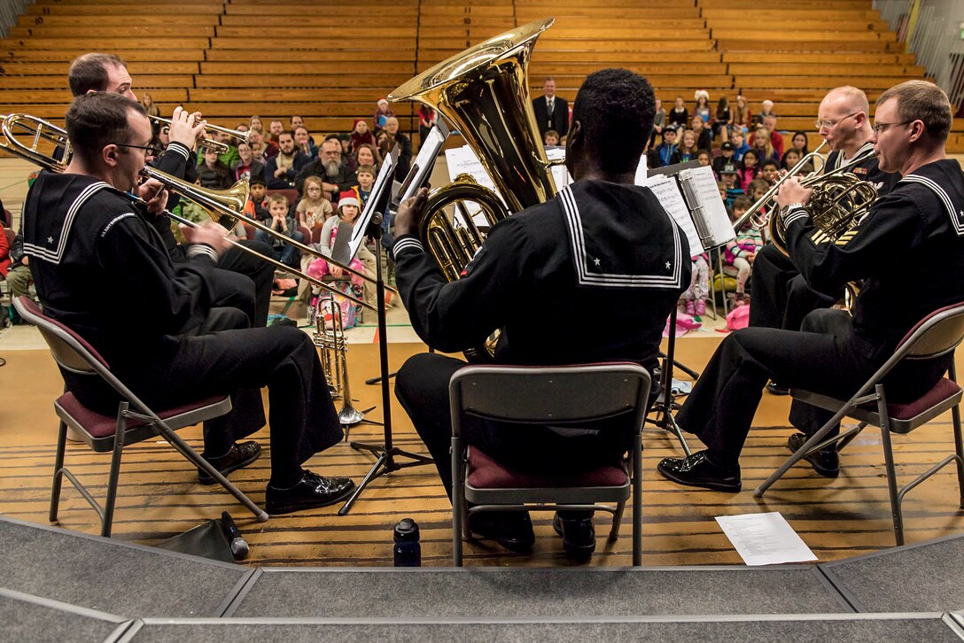 Navy Band Northwest's Brass Quintet performs a holiday concert at Central Kitsap Middle School for parents, students and staff in Silverdale, Wash., Dec. 14, 2016. This was the first time that the Brass Quintet has played at Central Kitsap Middle School. Navy photo by Petty Officer 2nd Class Jacob G. Sisco