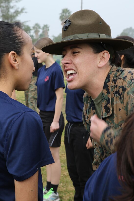 Drill Instructor Staff Sgt. Mallory R. Ortiz commands Cindy Magana, a future Marine from Recruiting Sub Station Bakersfield East, to respond properly to a command during a female future Marine function for Recruiting Station Los Angeles at Sherman Oaks Recreation Park, Dec. 10, 2016. (U.S. Marine Corps photo by Staff Sgt. Alicia R. Leaders/Released)