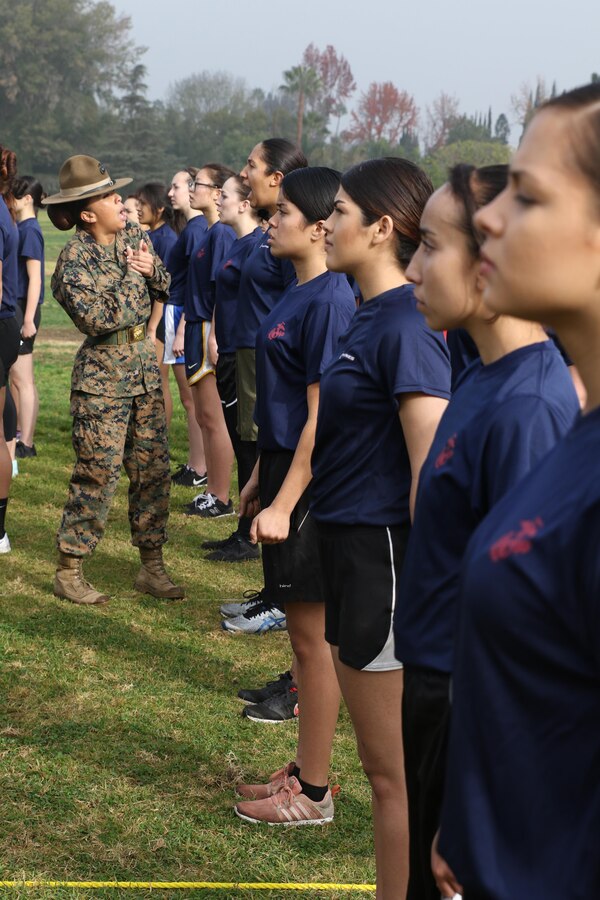 Drill Instructor Staff Sgt. MaryAnn Huffine commands a future Marine to properly execute a drill movement during a female future Marine function for Recruiting Station Los Angeles at Sherman Oaks Recreation Park, Dec. 10, 2016. (U.S. Marine Corps photo by Staff Sgt. Alicia R. Leaders/Released)