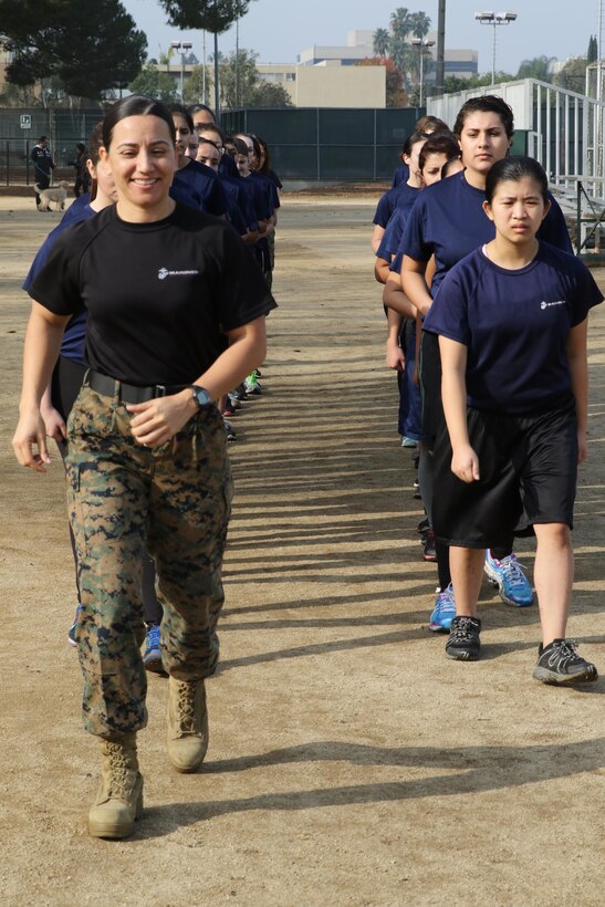 Recruiting Station Los Angeles Commanding Officer, Maj. Aixa R. Dones, leads future Marines on a motivational cadence run during a female future Marine function for Recruiting Station Los Angeles at Sherman Oaks Recreation Park, Dec. 10, 2016. (U.S. Marine Corps photo by Staff Sgt. Alicia R. Leaders/Released)