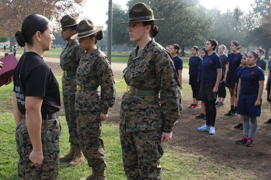 Recruiting Station Los Angeles Commanding Officer, Maj. Aixa R. Dones, recognizes Drill Instructors Staff Sgt. Mallory R. Ortiz, right, Staff Sgt. MaryAnn Huffine, center, and Sgt. Jasmine James, left, for their involvement at the female future Marine function for Recruiting Station Los Angeles at Sherman Oaks Recreation Park, Dec. 10, 2016. (U.S. Marine Corps photo by Staff Sgt. Alicia R. Leaders/Released)