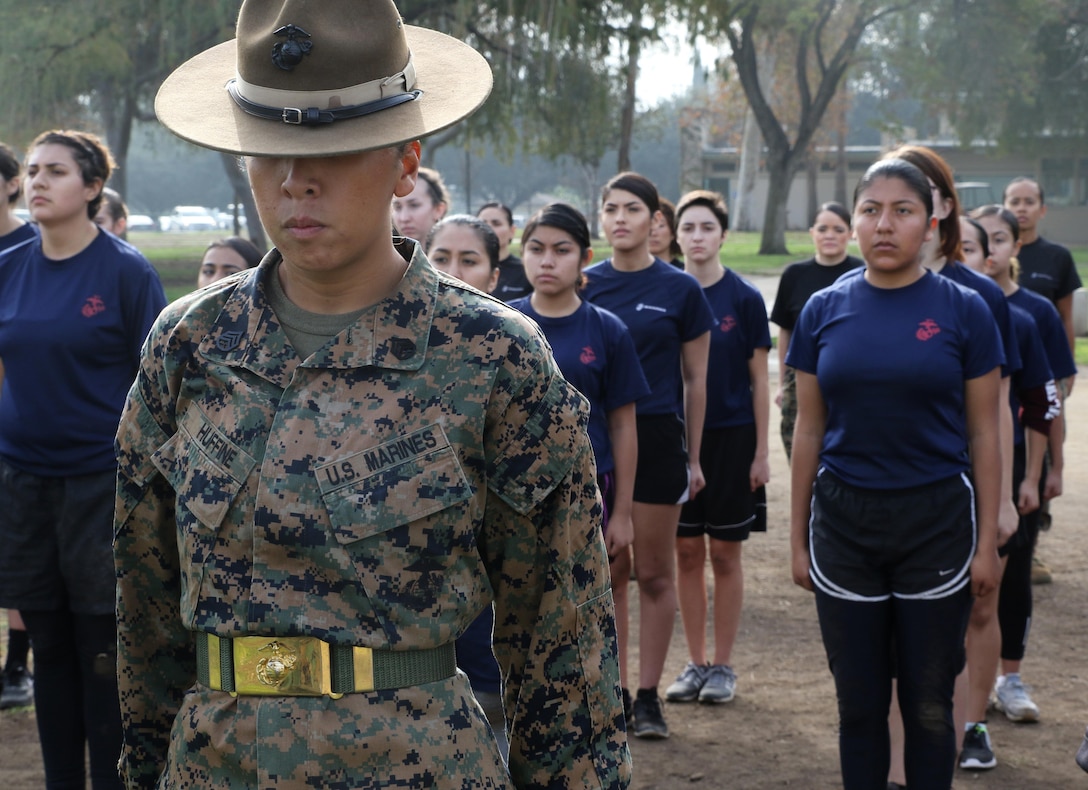 Staff Sgt. MaryAnn Huffine waits to be recognized by the Recruiting Station Los Angeles Commanding Officer, Maj. Aixa R. Dones, for her involvement at the female future Marine function for Recruiting Station Los Angeles at Sherman Oaks Recreation Park, Dec. 10, 2016. (U.S. Marine Corps photo by Staff Sgt. Alicia R. Leaders/Released)