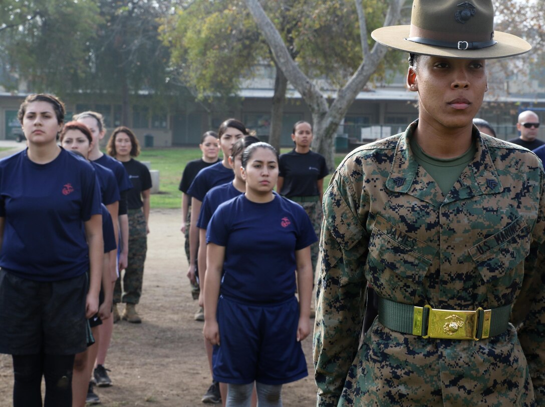 Sgt. Jasmine James waits to be recognized by the Recruiting Station Los Angeles Commanding Officer, Maj. Aixa R. Dones, for her involvement at the female future Marine function for Recruiting Station Los Angeles at Sherman Oaks Recreation Park, Dec. 10, 2016. (U.S. Marine Corps photo by Staff Sgt. Alicia R. Leaders/Released)