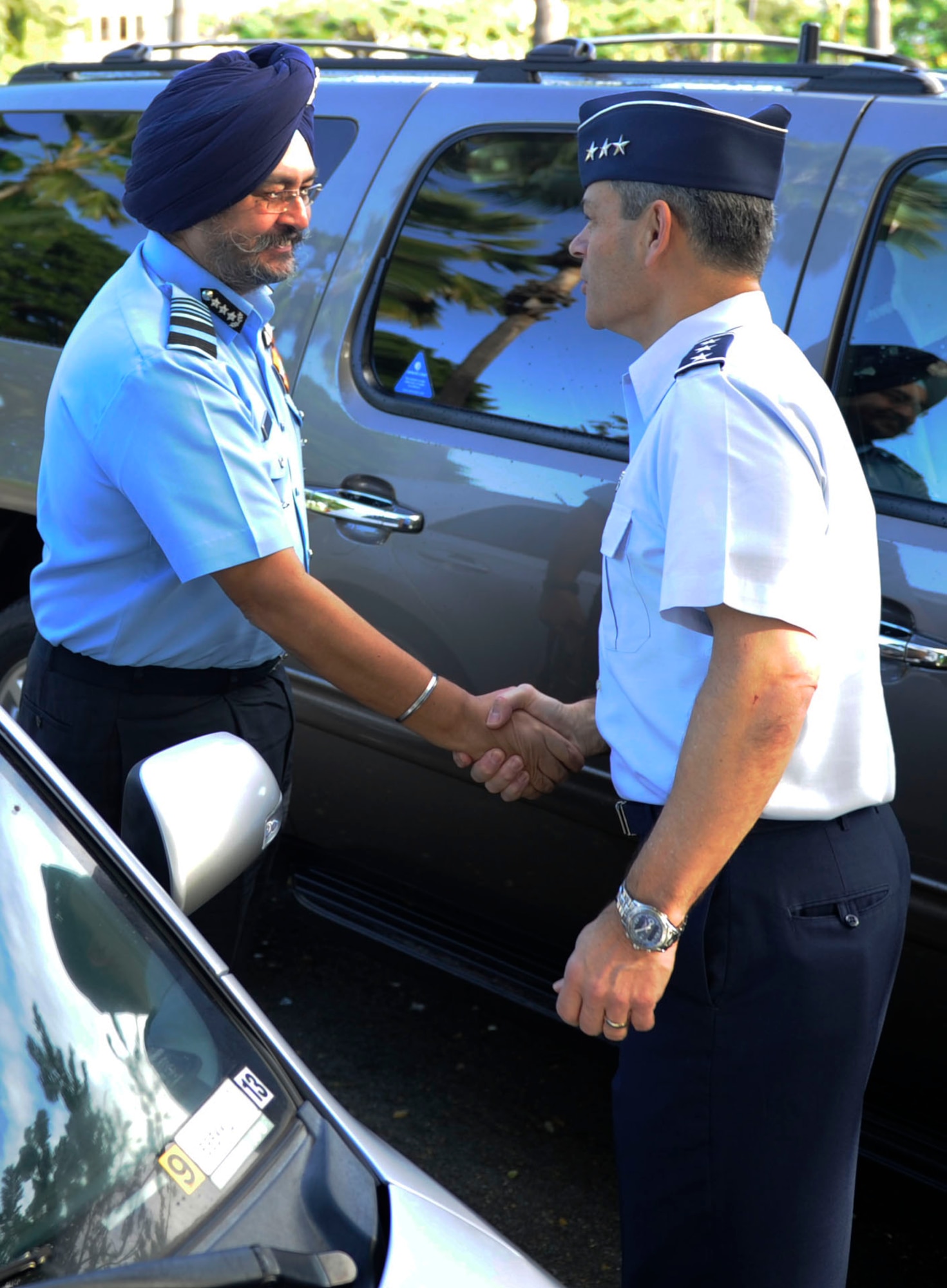 U.S. Air Force Lt. Gen. Ken Wilsbach, Commander, 11th Air Force, greets Indian Air Force Air Marshal Birender Dhanoa, Vice Chief of the Air Staff, upon arrival to Joint Base Pearl Harbor-Hickam, Dec. 13, 2016, in support of the Executive Steering Group.  Senior military leaders from the Indian Air Force and the U.S. Air Force held an executive steering group meeting to discuss operational concepts and chart the way ahead for future training exchanges and exercises between both militaries. (U.S. Air Force photo by Master Sgt. George Maddon)