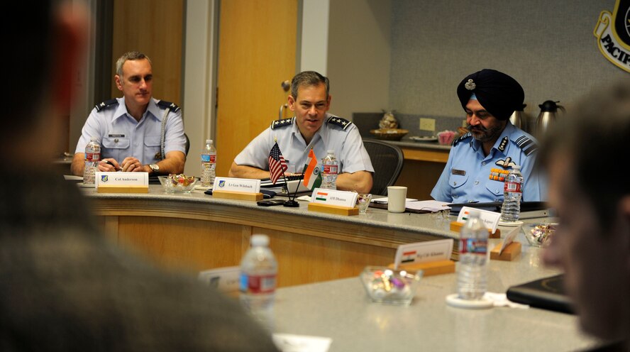 U.S. Air Force Lt. Gen. Ken Wilsbach, commander 11th Air Force, seated with Indian Force Air Marshal Birender Dhanoa, Vice Chief of the Air Staff, Dec. 13, 2016, issues his opening remarks, officially beining the first day of the Executive Steering Group.  Senior military leaders from the Indian Air Force and the U.S. Air Force held an executive steering group meeting to discuss operational concepts and chart the way ahead for future training exchanges and exercises between both militaries. (U.S. Air Force photo by Master Sgt. George Maddon)