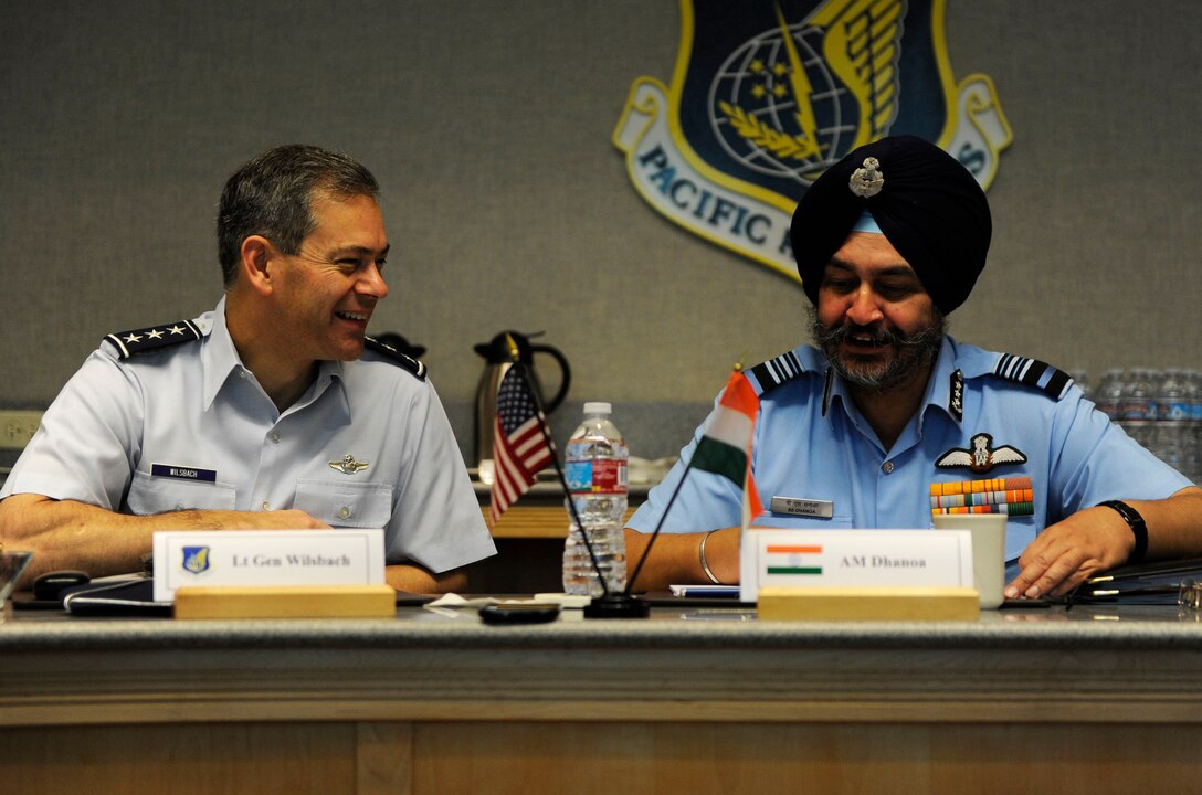 Indian Air Force Air Marshal Birender Dhanoa, Vice Chief of the Air Staff, follows the opening remarks of U.S. Air Force Lt. Gen. Ken Wilsbach, commander 11th Air Force, seated to his right, with opening remarks of his own, Dec. 12, 2016, in support of the Executive Steering Group.  Senior military leaders from the Indian Air Force and the U.S. Air Force held an executive steering group meeting to discuss operational concepts and chart the way ahead for future training exchanges and exercises between both militaries. (U.S. Air Force photo by Master Sgt. George Maddon)