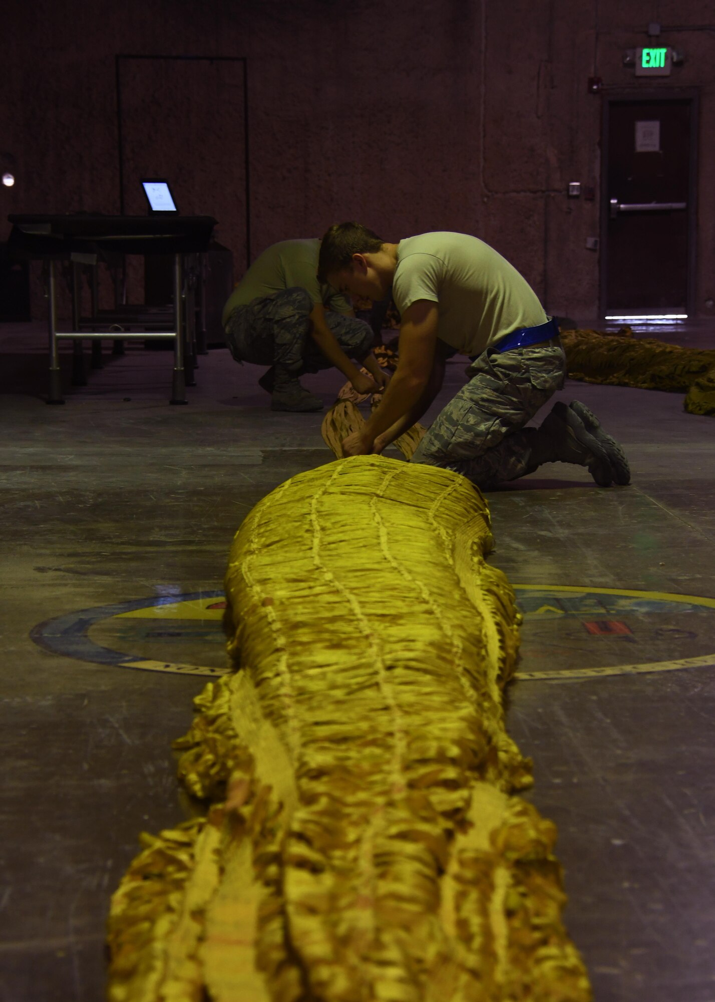 U.S. Airman 1st Class Eric Hornbeck, 379th Expeditionary Operations Support Squadron aircrew flight equipment technician, prepares a drag parachute to be packed into a deployment bag at Al Udeid Air Base, Qatar, Nov. 30, 2016. As part of his duties, Hornbeck ensures that any equipment that may be needed by aircrew in an emergency is inspected and operating correctly. (U.S. Air Force photo by Senior Airman Miles Wilson)
