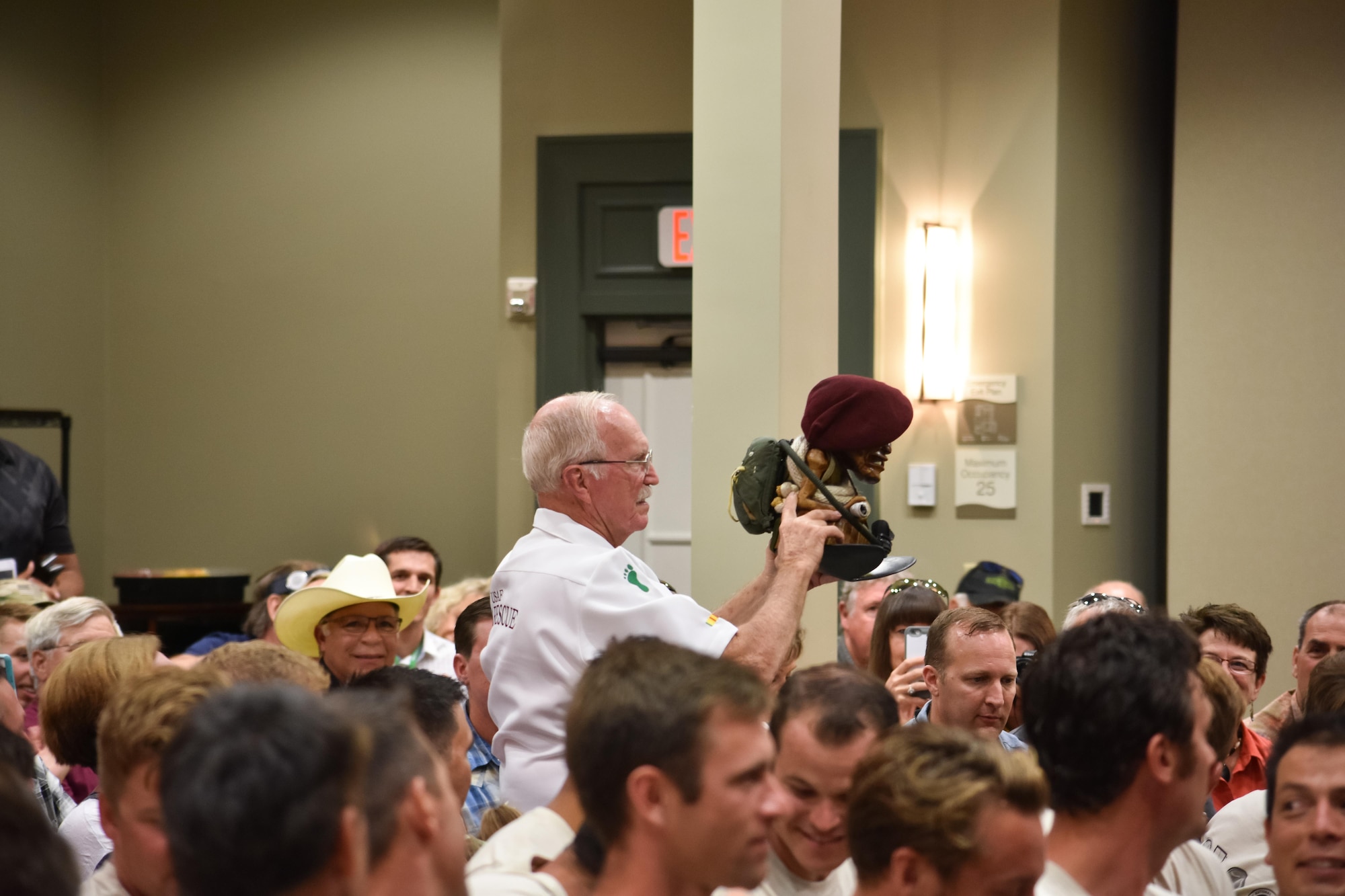 Charlie “Chuck” Morrow, president of the Pararescue Association and former pararecueman, displays the pararesuce mascot, Charlie, at the 2016 Pararescue Reunion in Melbourne, Florida, Sept. 23, 2016. Morrow is the recipient of three Sliver Stars and five Distinguished Flying Crosses for his actions and service during the Vietnam War. (U.S. Air Force photo/Staff Sgt. Dana White)