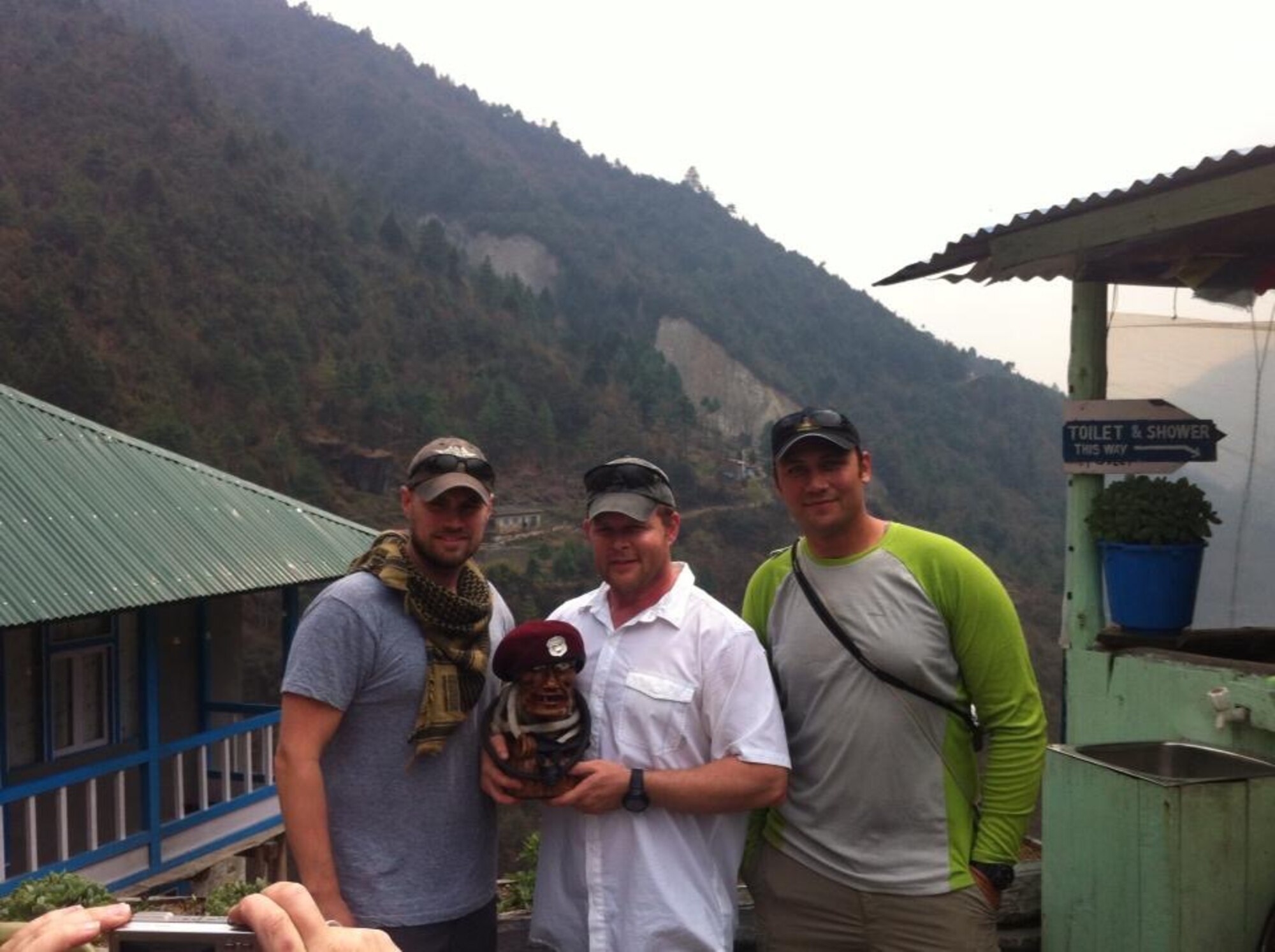 Then-Senior Master Sgt. Robert Disney, a Wounded Warrior and PJ, holds "Charlie" the PJ during a journey to the Mt. Everest base camp in the Himalayas in 2013. On the trip, Disney met the Dalai Lama, who presented him with a medallion that Charlie now wears. (Courtesy photo)