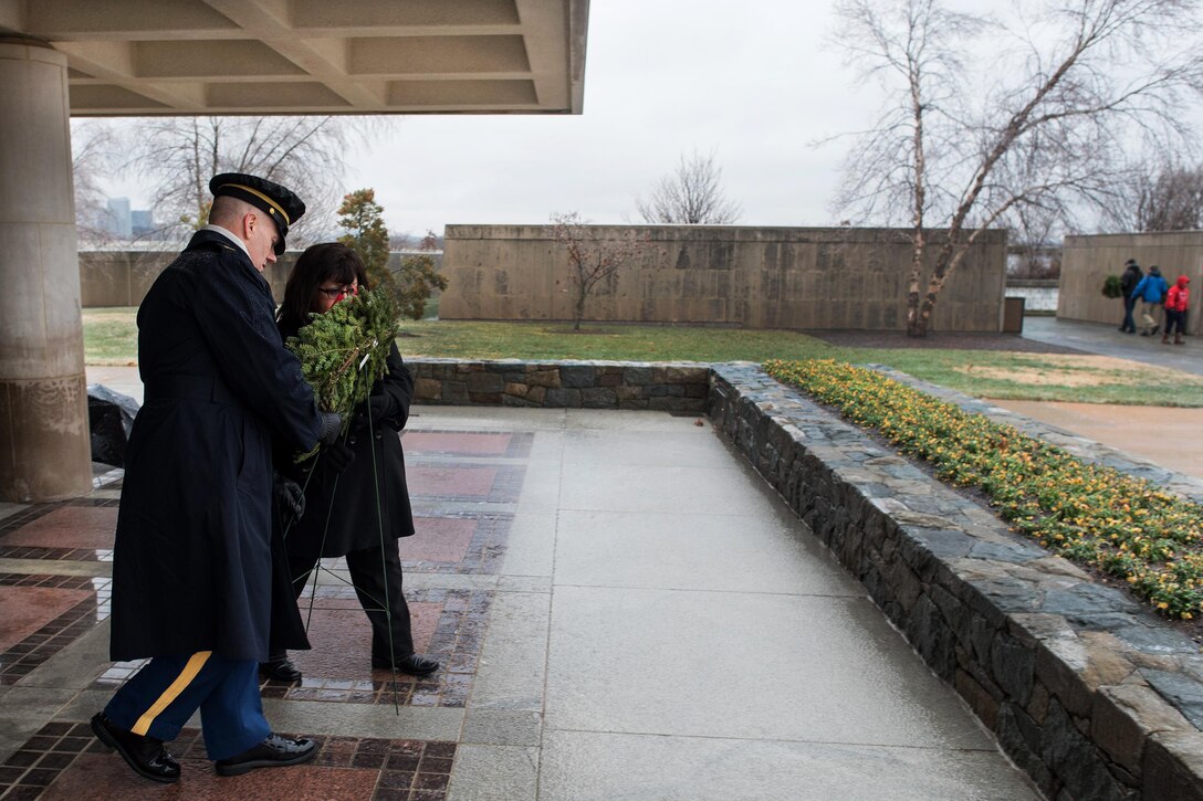 Army Command Sgt. Maj. John W. Troxell, left, senior enlisted advisor to the chairman of the Joint Chiefs of Staff, and his wife, Sandra, place a wreath at the columbarium at Arlington National Cemetery, Va., Dec. 17, 2016, during Wreaths Across America. DoD photo by Army Sgt. James K. McCann