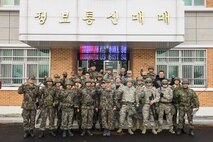 Members of the 51st Communications Squadron pose with their Republic of Korea air force counterparts after the conclusion of a joint communications exercise at Gwanju Air Base, ROK, Dec. 13, 2016. The exercise allowed the U.S. and ROK Airmen to share their expertise and operating procedures, furthering their ability to work together in the field. (U.S. Air Force photo by Senior Airman Victor J. Caputo)