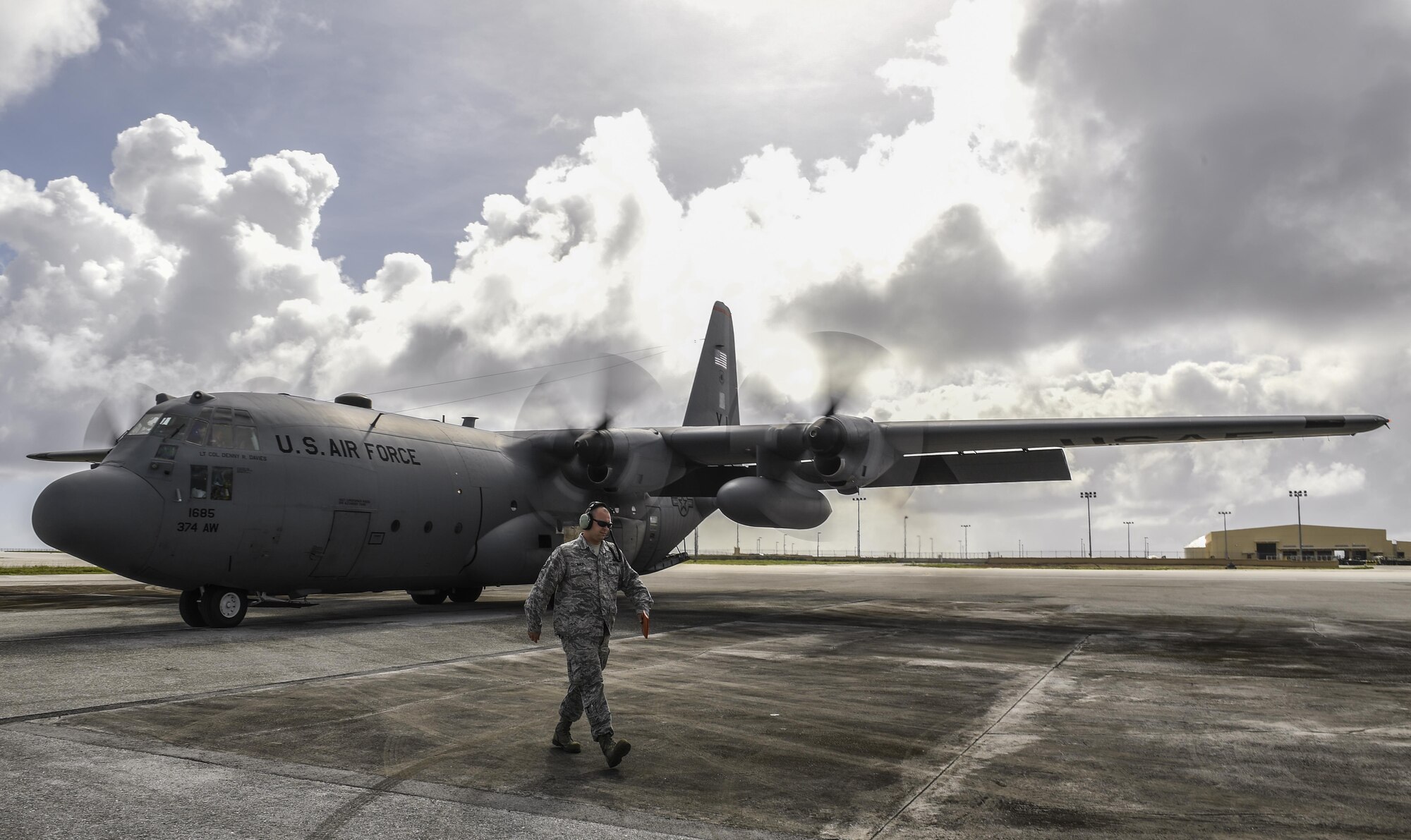 Master Sgt. Christopher Mace, 374th Aircraft Maintenance Squadron crew chief, prepares to marshal a C-130H Hercules assigned to the 36th Airlift Squadron during Operation Christmas Drop 2016 at Andersen Air Force Base, Guam, Dec. 7, 2016. Operation Christmas Drop is a joint-training operation between the U.S. Air Force, the Royal Australian Air Force and the Japanese Air Self Defense Force wherein C-130 air crews deliver bundles of donated supplies to the Micronesian Islands. This year is the 65th anniversary of OCD, making it the longest running humanitarian mission in the world. (U.S. Air Force photo by Senior Airman Elizabeth Baker/)