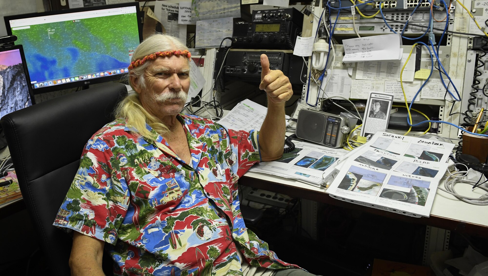 Bruce Best, University of Guam researcher, waits for incoming radio transmissions during Operation Christmas Drop, at the University of Guam, Guam, Dec. 7, 2016. Each year OCD provides aid to over 30,000 islanders in Chuuk, Palau, Yap, Marshall Islands and Commonwealth of the Northern Mariana Islands, delivered via C-130H Hercules. Best is the line of communication between the islands and the C-130 aircrews, ensuring that each bundle of goods arrives safely at its drop zone. (U.S. Air Force photo by Senior Airman Elizabeth Baker)