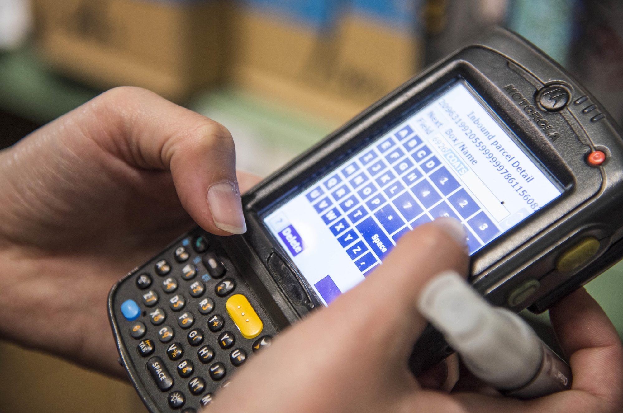 U.S. Air Force Senior Airman Reina Clayton, a 35th Communications Squadron postal service clerk, inputs item numbers into a postal system at Misawa Air Base, Japan, Dec. 14, 2016. When items are sent, they receive a tracking number originating from the United States Postal Service systems which includes the sender and receiver information. The system connects to all postal services across the U.S. to show the location of the package at all times. (U.S. Air Force photo by Airman 1st Class Sadie Colbert)