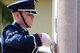 Airman 1st Class Albert White, an Andersen Air Force Base Honor Guardsman, secures the flag during the Operation Linebacker II Remembrance Ceremony Dec. 16, 2016, at Andersen AFB, Guam. The flag was lowered to half-staff where it is expected to remain for 11 days to honor those who were lost during the operation. (U.S. Air Force photo/Airman 1st Class Jacob Skovo)