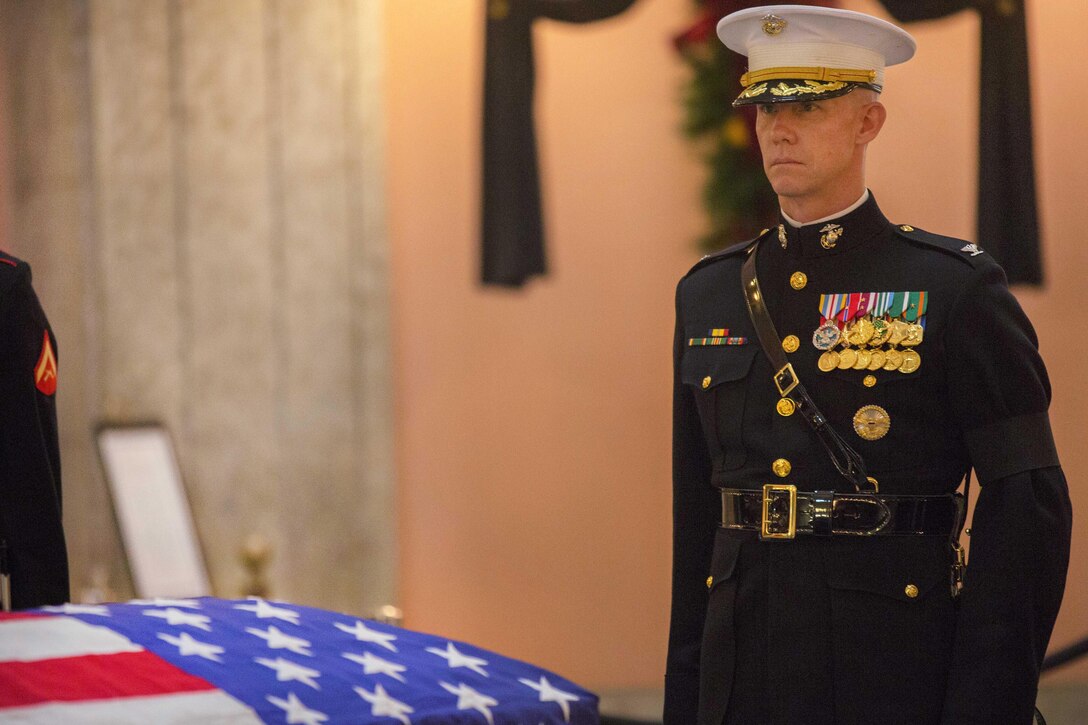 Marine Corps Col. Tyler J. Zagurski, commanding officer of Marine Barracks Washington, stands at attention in front of the casket of John Glenn at the Ohio Statehouse in Columbus, Dec. 16, 2016. Glenn, a former Marine Corps fighter pilot, astronaut, Ohio state senator and U.S. senator, became the first man to orbit the earth in 1962. Glenn died Dec. 8, 2016, at age 95. Marine Corps photo by Lance Cpl. Paul Ochoa