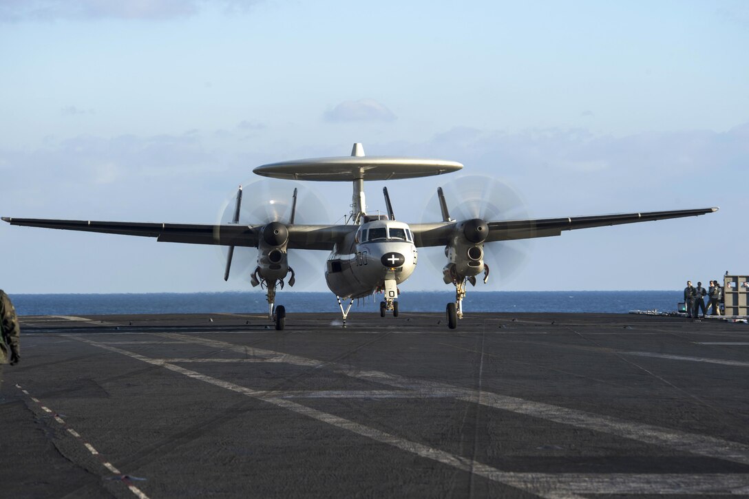 An E2-C Hawkeye lands on the aircraft carrier USS Dwight D. Eisenhower in the Mediterranean Sea, Dec. 10, 2016. The Hawkeye is assigned to Airborne Early Warning Squadron 130. Navy photo by Petty Officer 3rd Class Nathan T. Beard